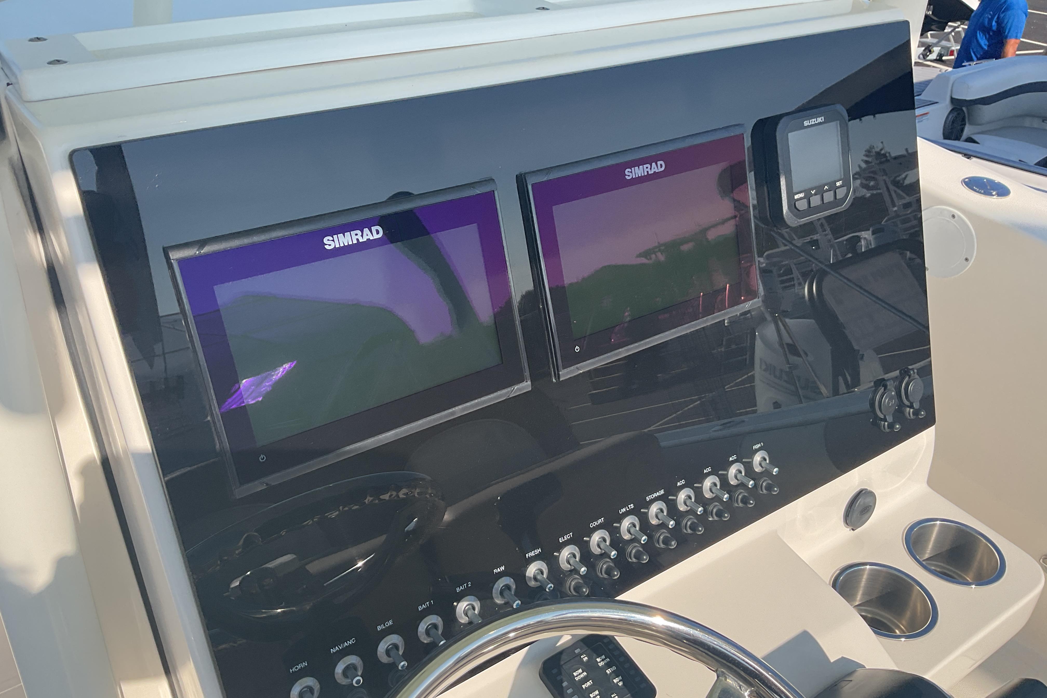 Control panel of 2023 Sea Born SX239 Offshore boat with Simrad displays.
