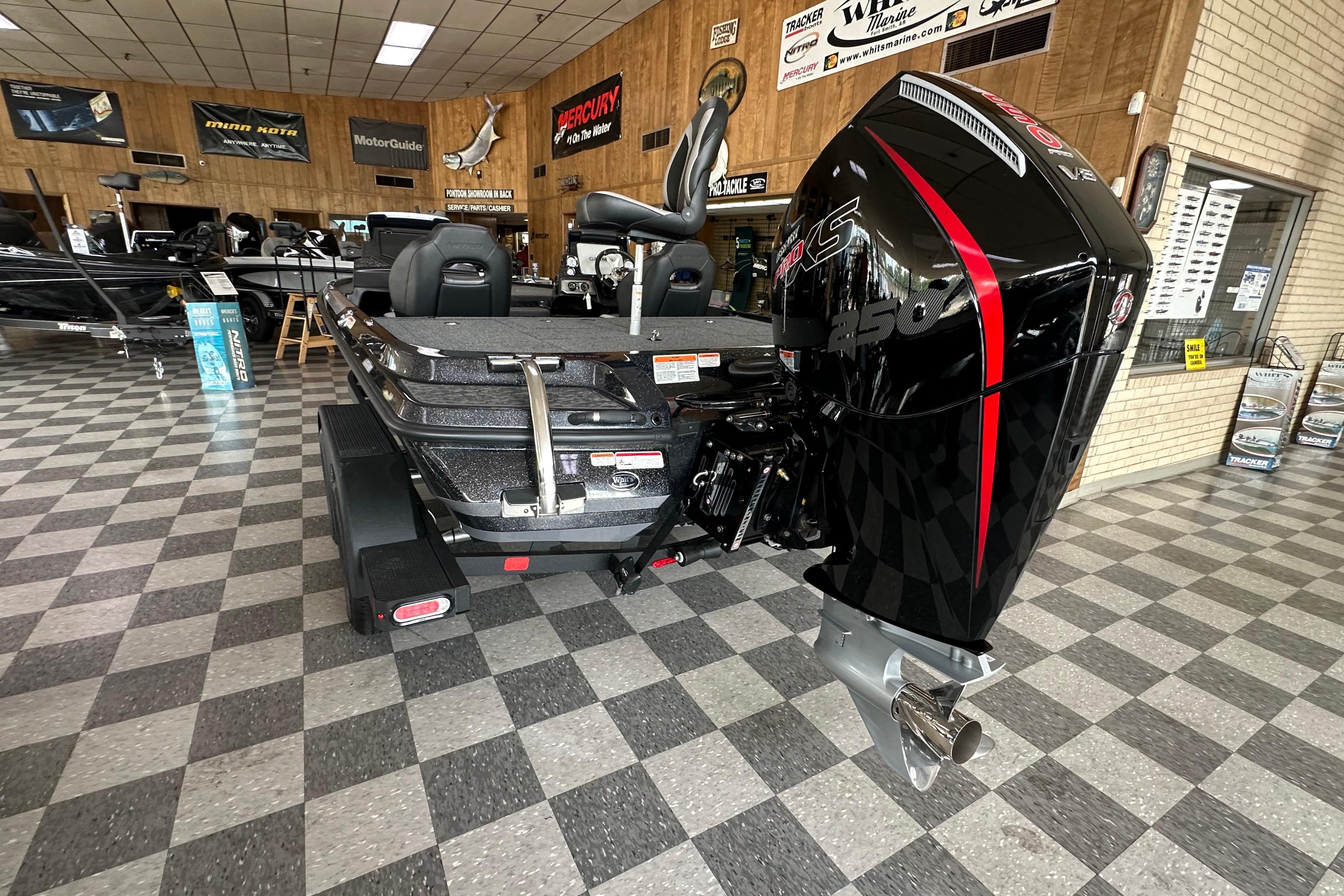 2025 Nitro Z20 XL Pro boat with powerful outboard motor in showroom setting.