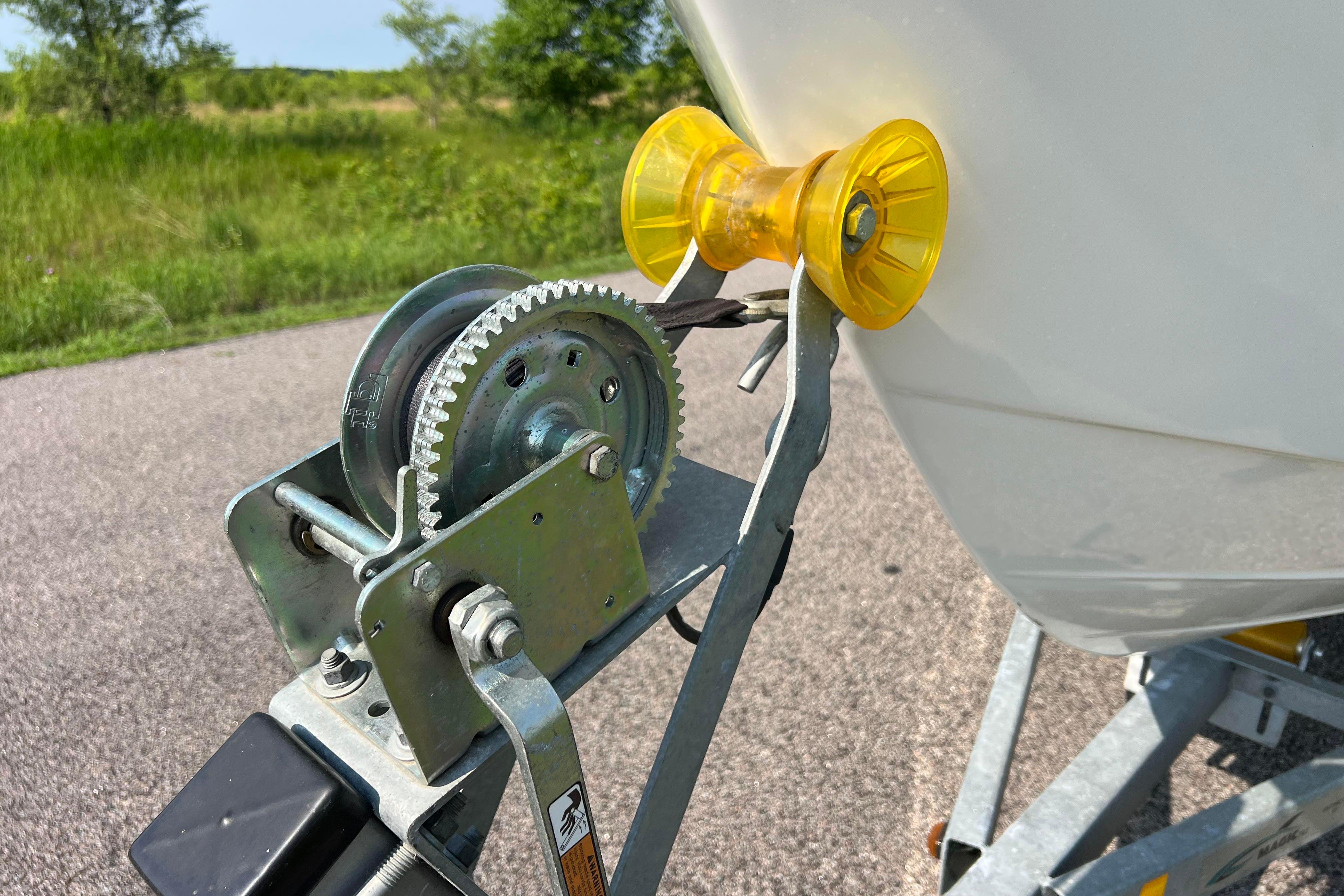 Boat trailer winch and roller for 2012 Sea Fox 206 Center Console on a sunny day.