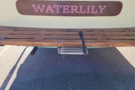 1985 Wasque Down East Cruiser "Waterlily" with wooden deck and ladder.