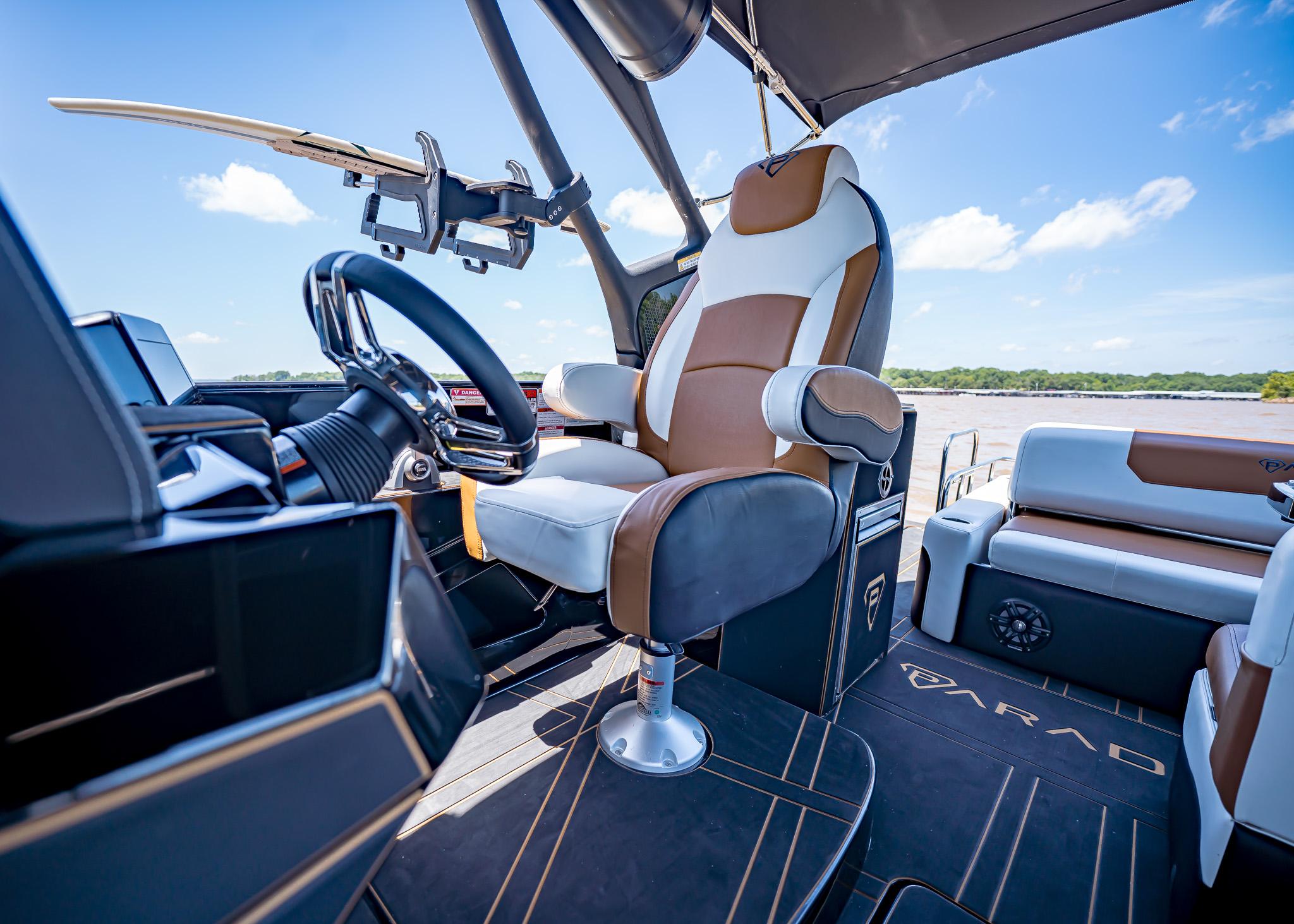 Luxurious Paradigm 236 boat interior with modern steering and seating, 2025 model.