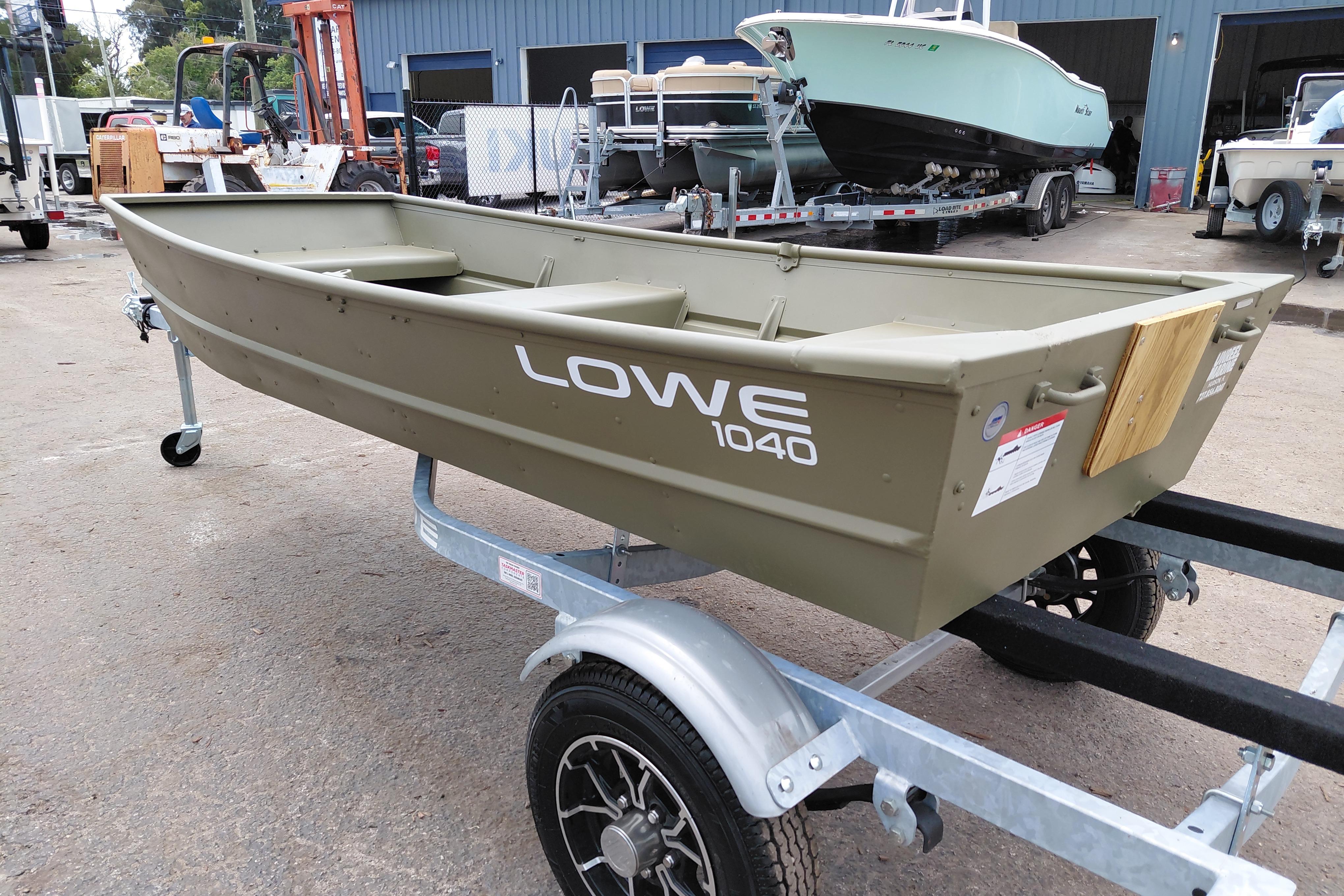 2025 Lowe L1040 Jon boat on trailer in outdoor setting.