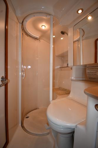 Bathroom interior of 2003 Sea Ray 460 Sundancer yacht, featuring shower and toilet.