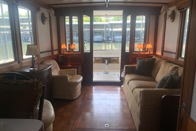 Interior of a 1986 Pilgrim 40 boat with cozy seating and elegant decor.