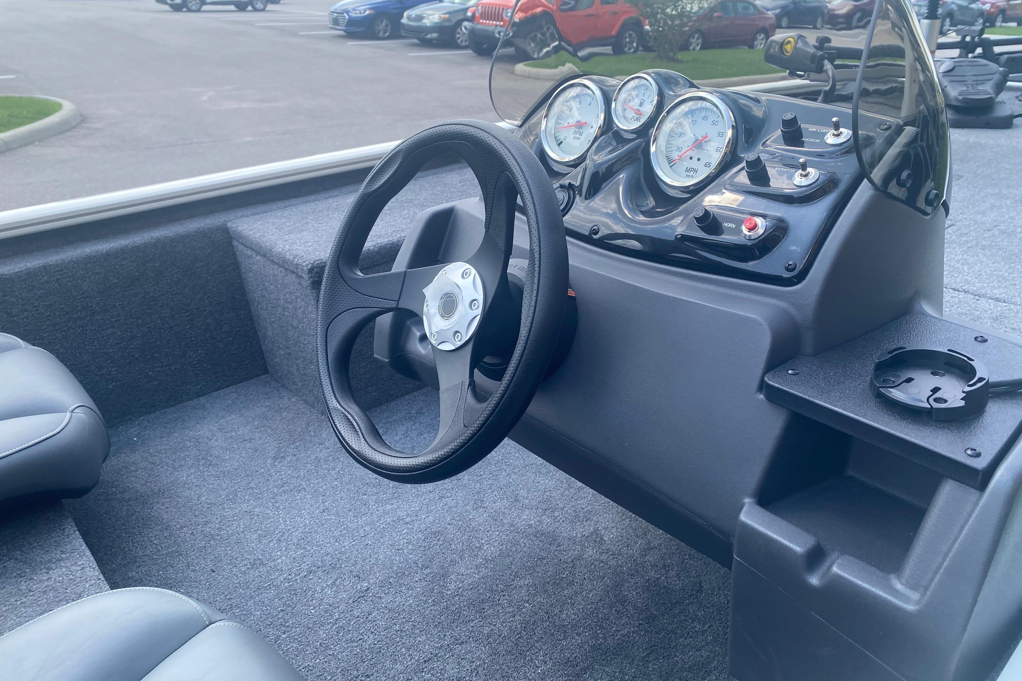 Steering console of 2026 Tracker Pro 170 boat with gauges and controls.