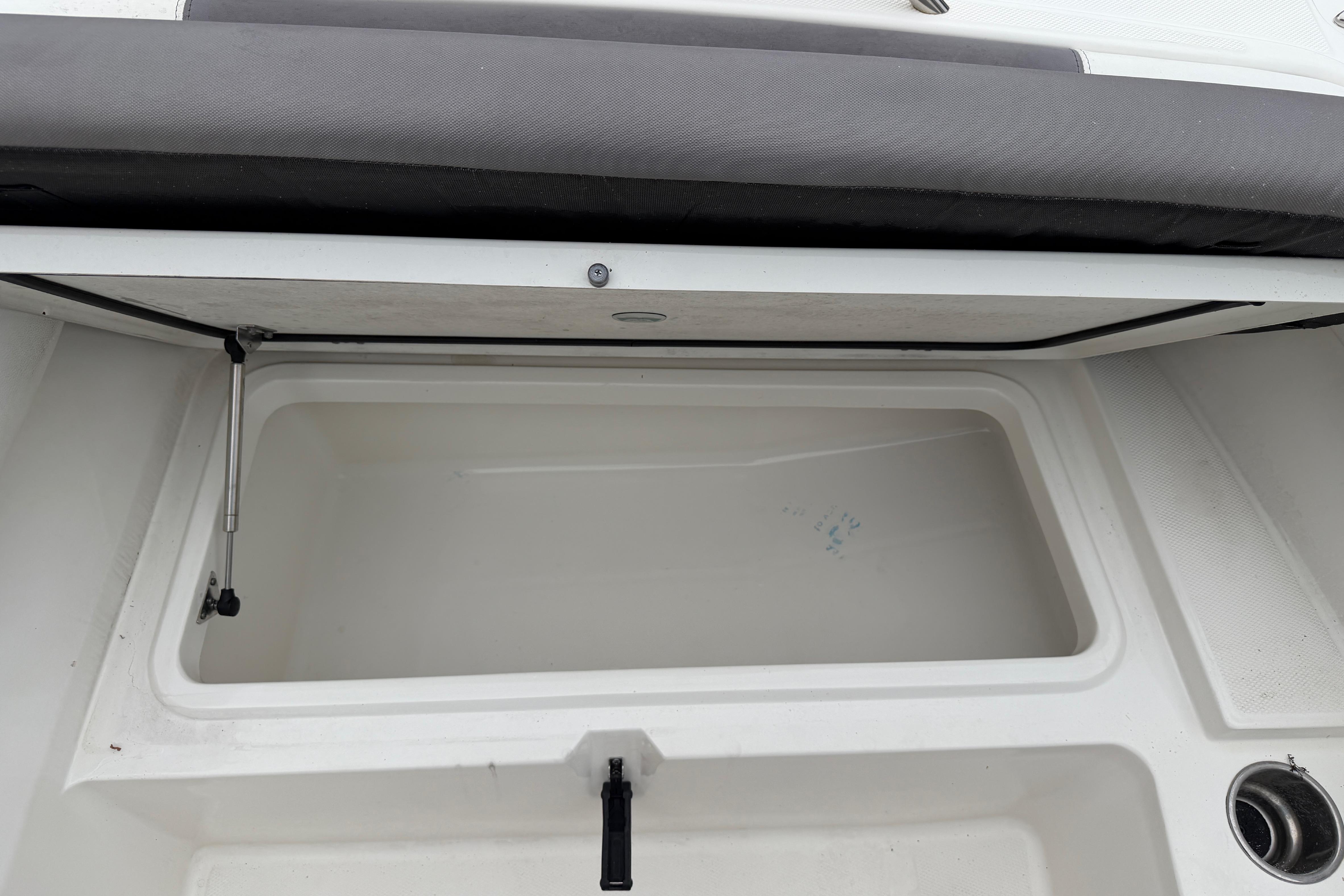 Open storage compartment on a 2019 World Cat 230 DC boat.