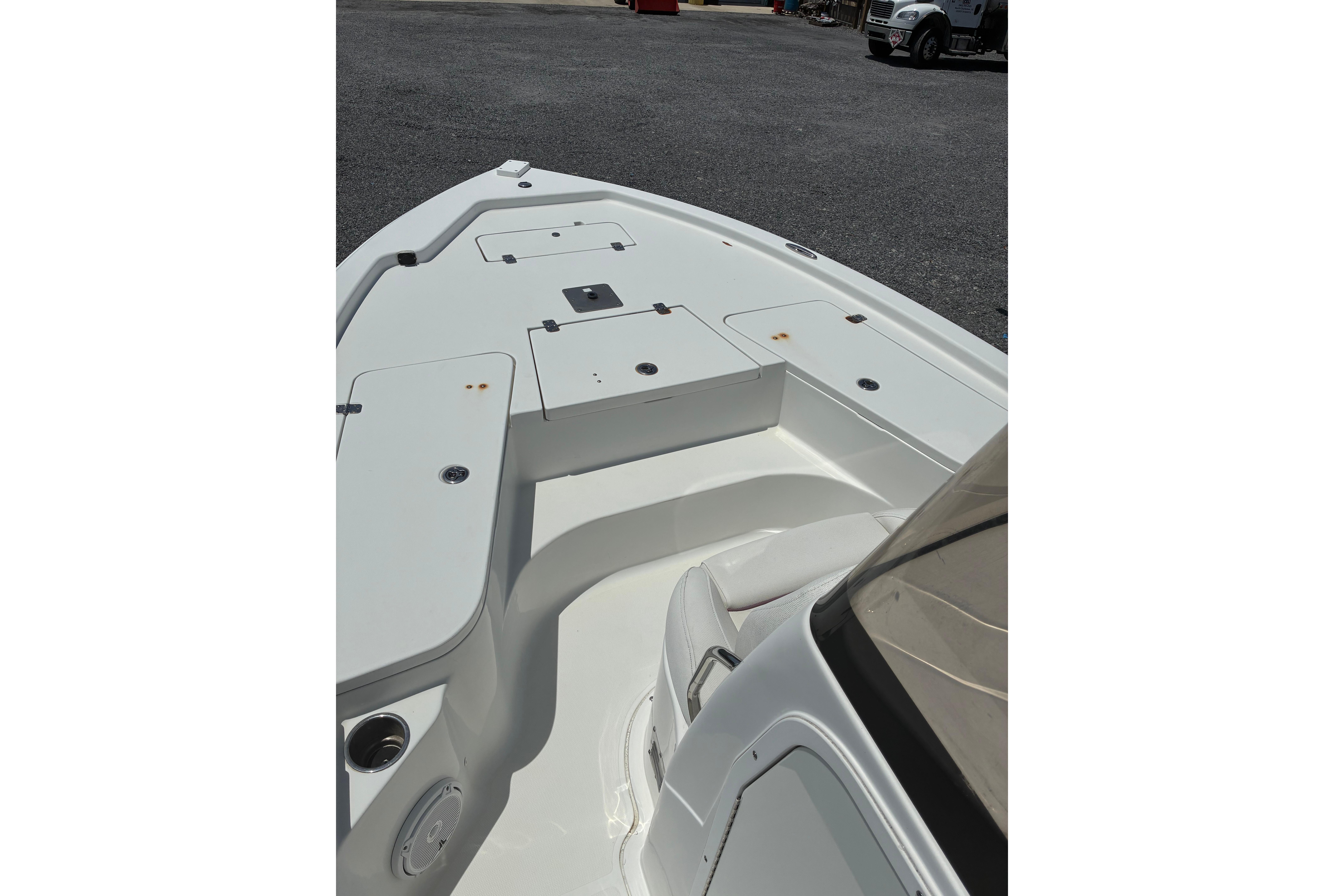 2014 Sea Hunt BX 20 BR boat deck with storage compartments and seating.
