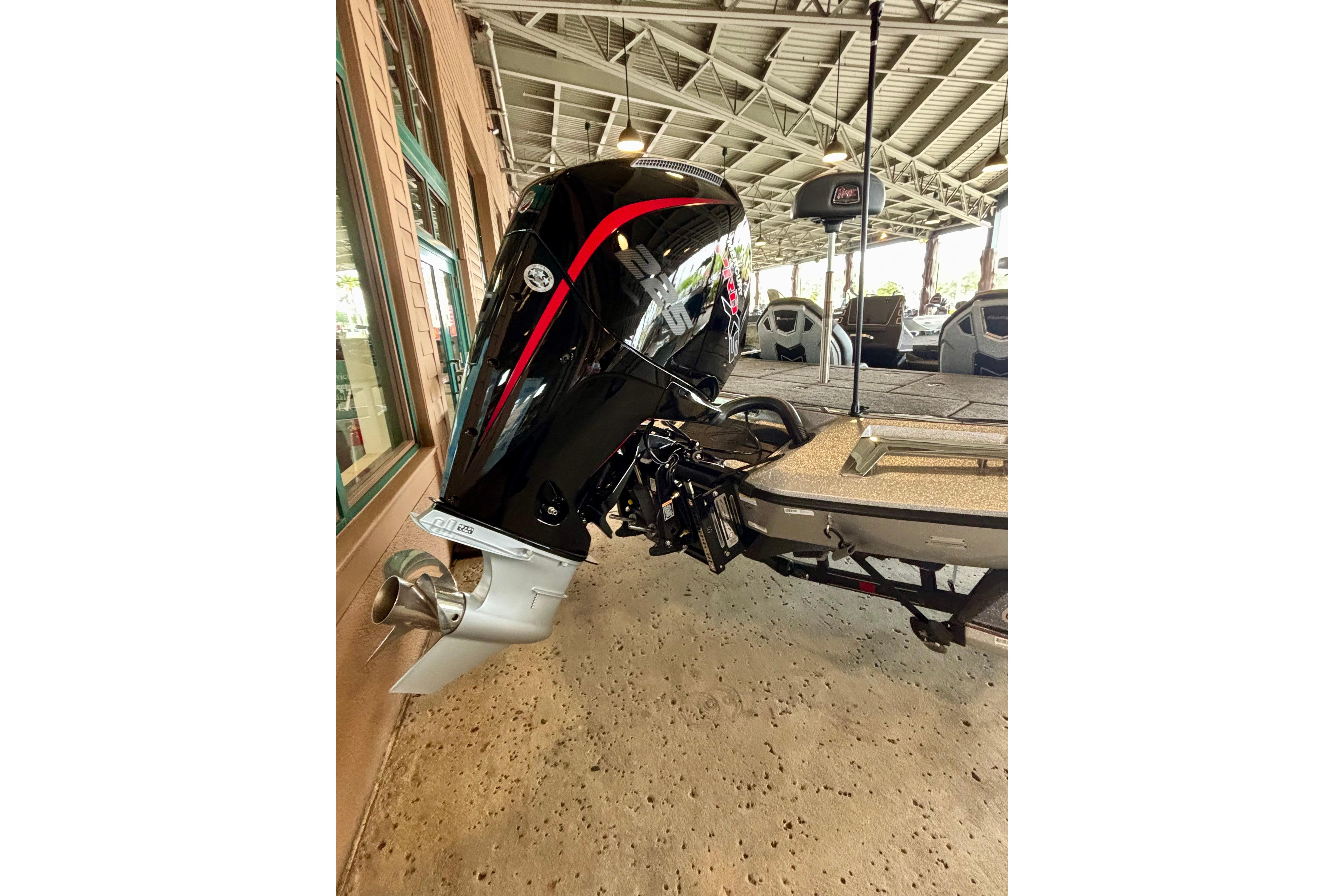 2025 Ranger Z519R boat with powerful outboard motor in a showroom setting.