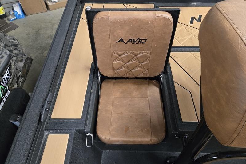 Brown leather seat in Avid 207 Recon boat, 2026 model, with logo detailing.