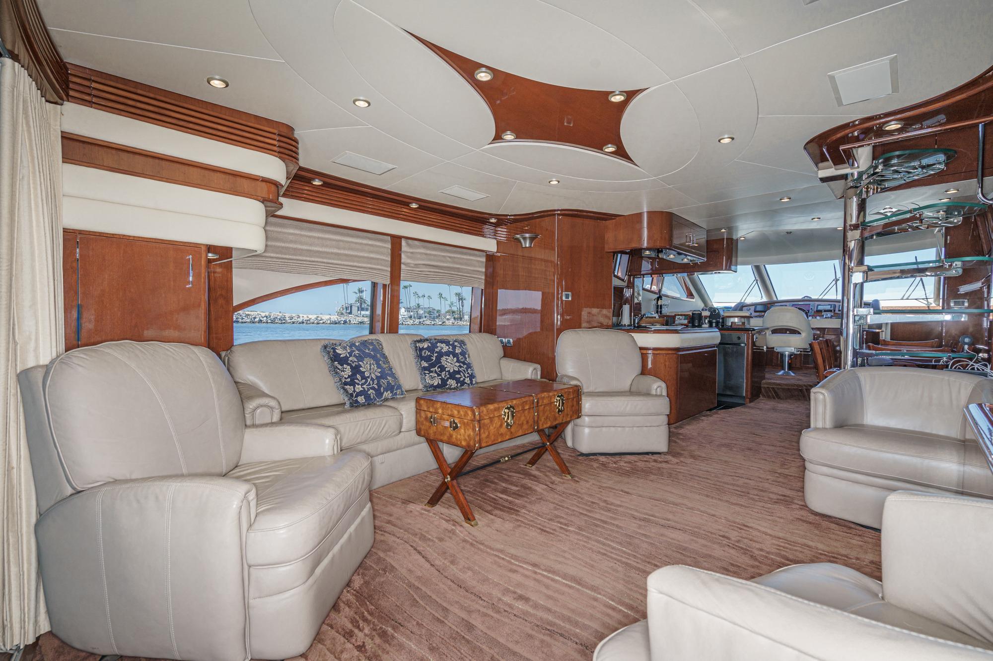 Luxurious interior of a 2005 Marquis 65 yacht with elegant seating and modern design.