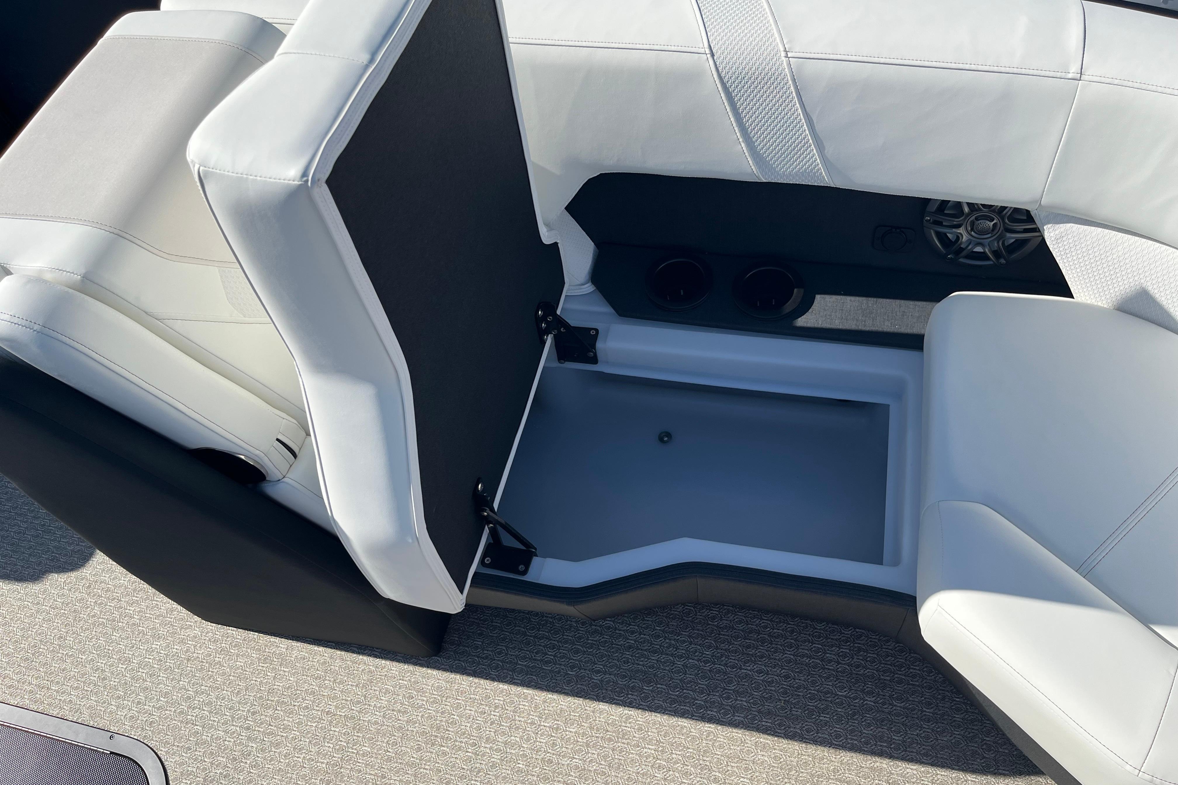 Interior of 2026 Evotti 523CS boat with open storage compartment and seating.