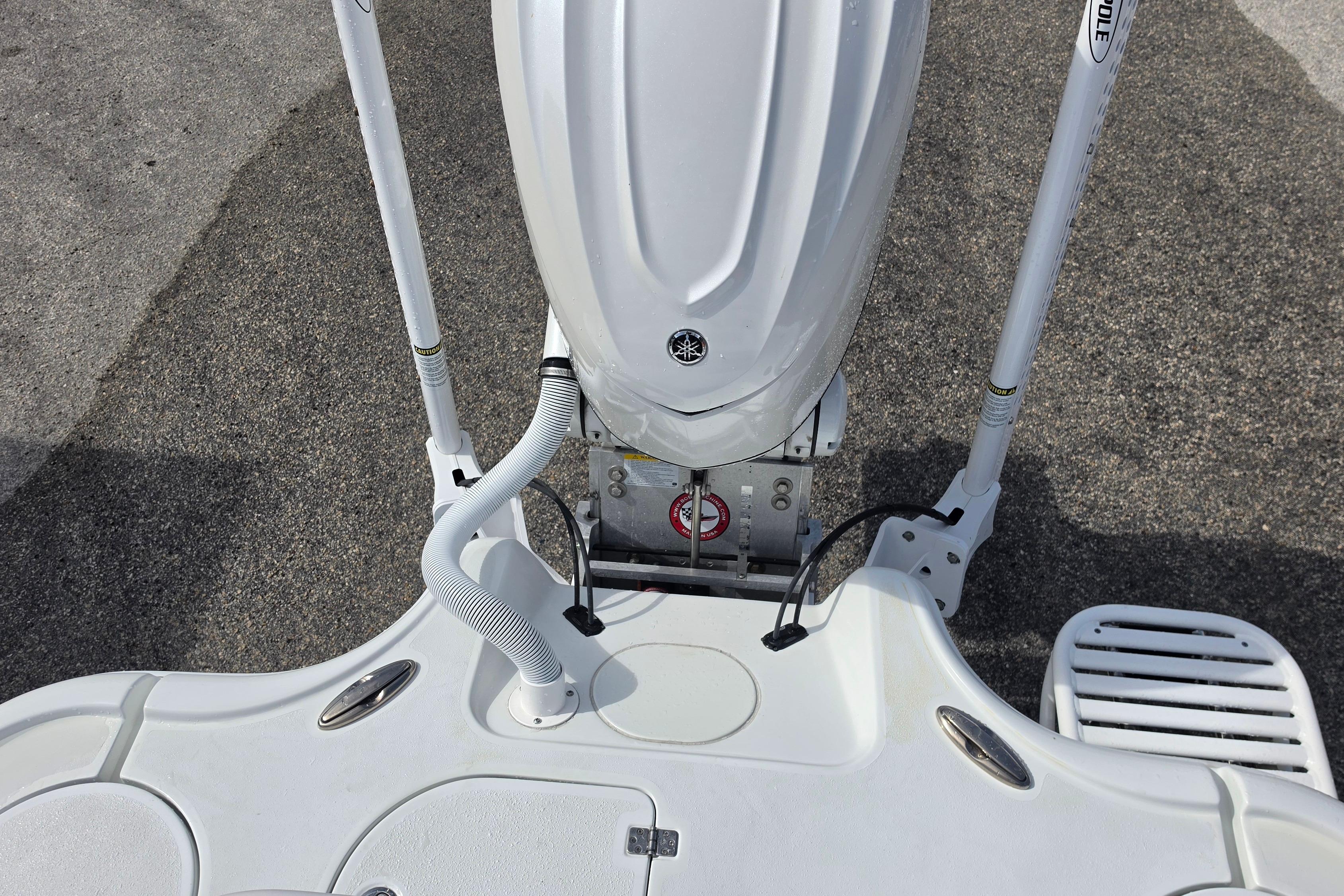 2026 Yellowfin 24 Bay CE boat engine and deck view.