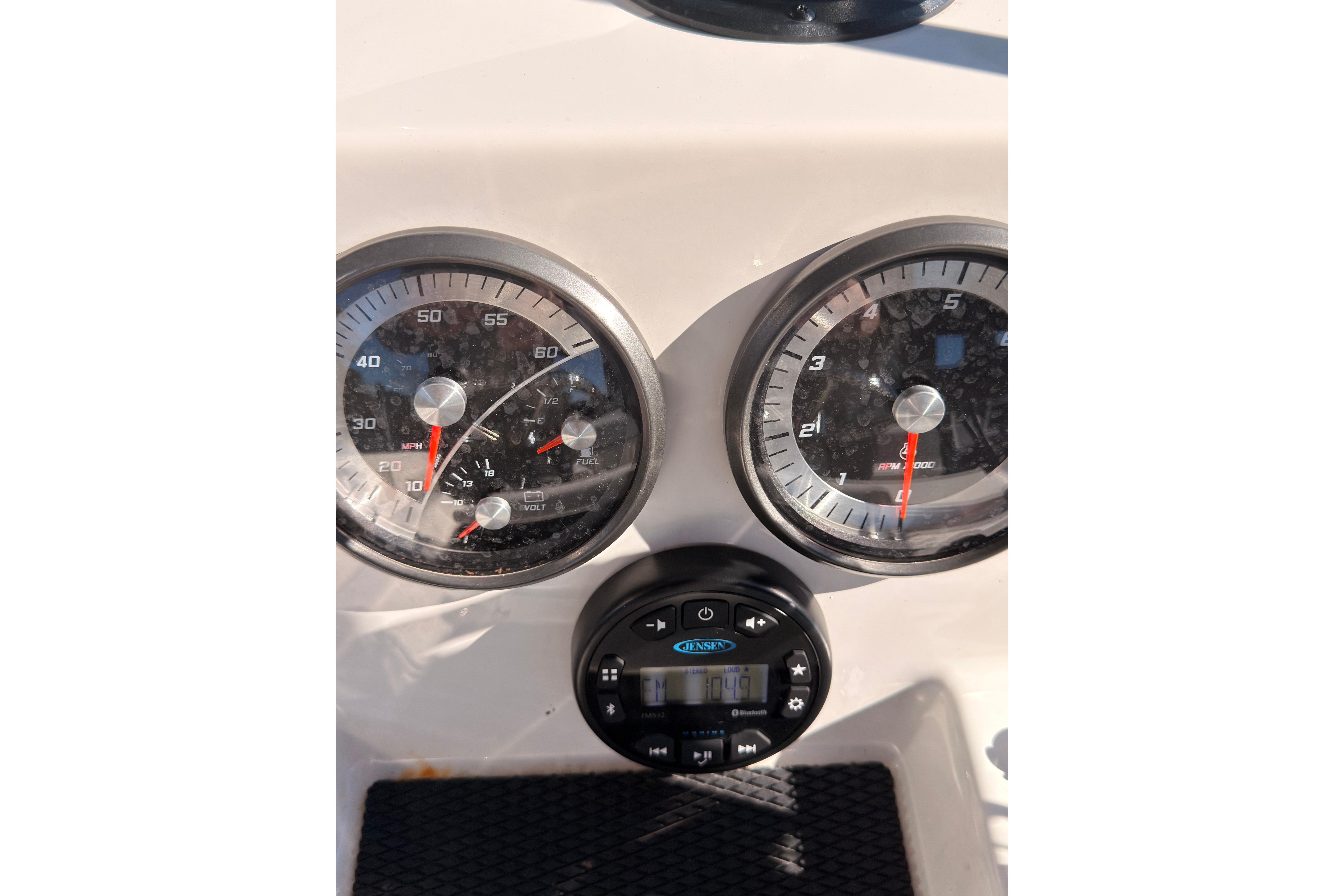 Dashboard of 2023 Trophy T-18 boat with speedometer and tachometer gauges.