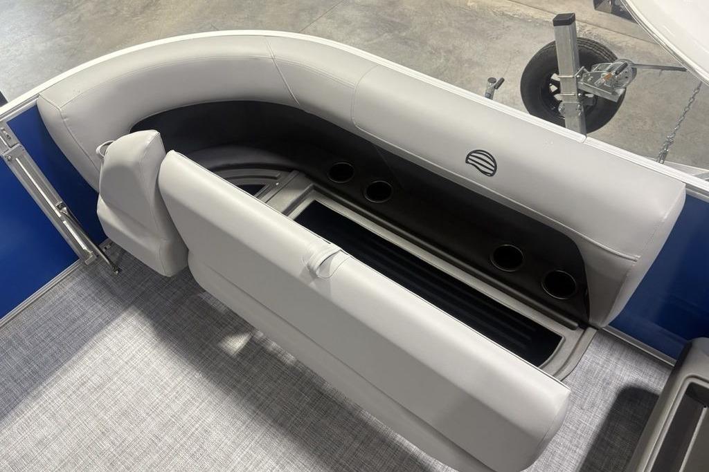 2026 Sun Tracker Party Barge 16 DLX interior seating with cup holders and storage.