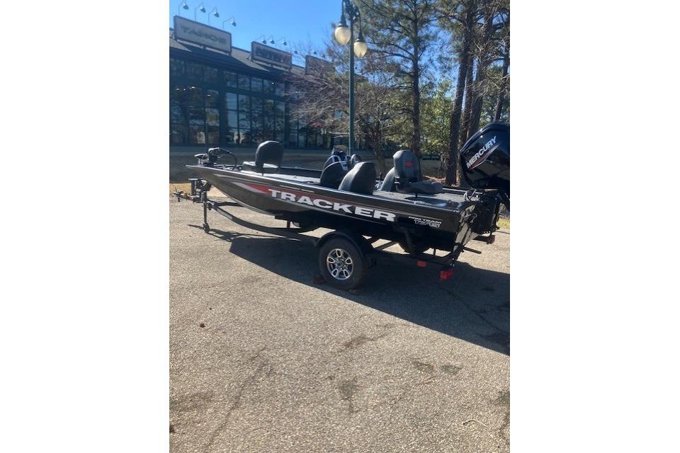 2026 Tracker Pro Team 175 boat parked outdoors, featuring sleek design and Mercury engine.