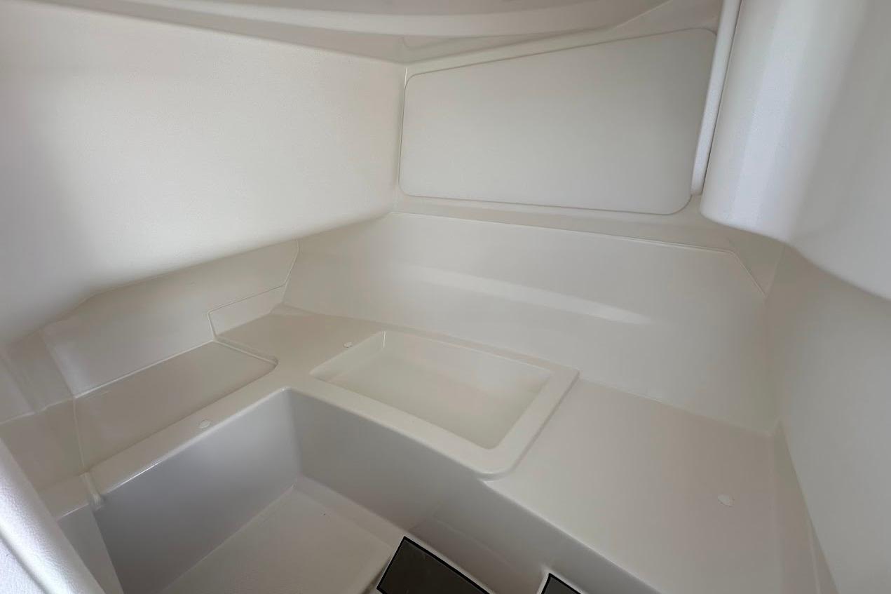 Interior of 2026 Sea Ray SDX 230 Surf boat, featuring sleek white design.