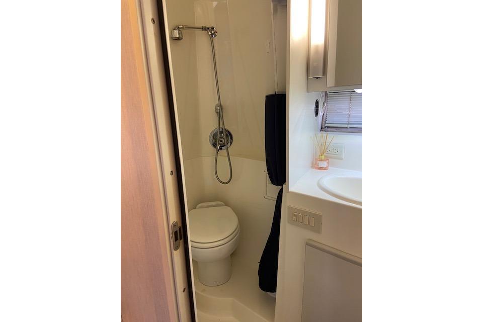 Bathroom interior of 1994 Cruisers Yachts 3675 Esprit with shower and toilet.