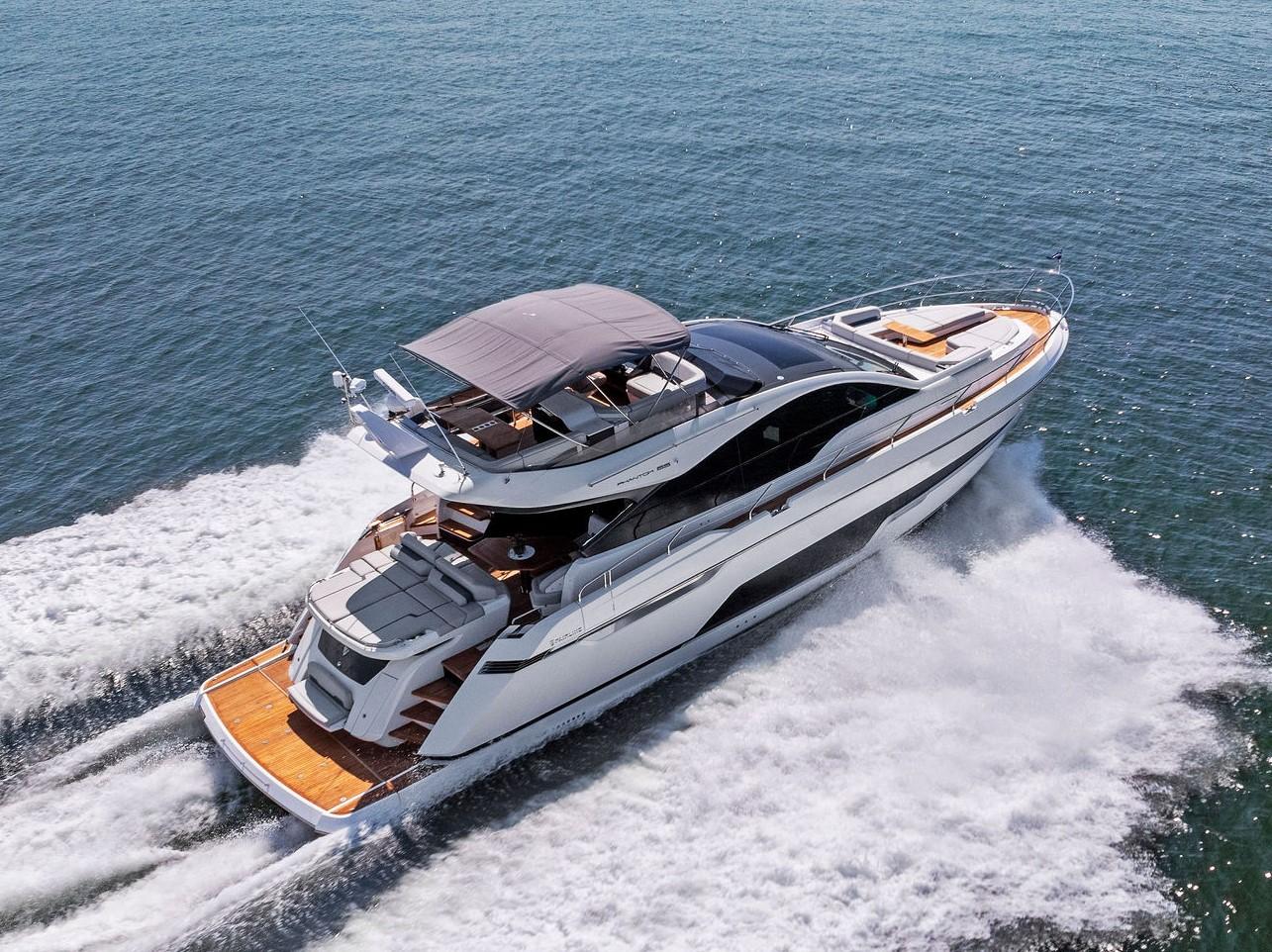 2024 Fairline Phantom 65 yacht cruising on open water, showcasing sleek design and luxury features.