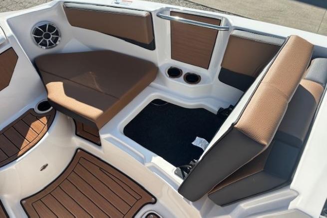 Interior of 2026 Yamaha Boats 222SE, featuring brown seating and modern design elements.