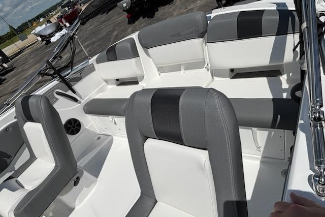 Interior of a 2026 Tahoe T21 boat with gray and white seating.