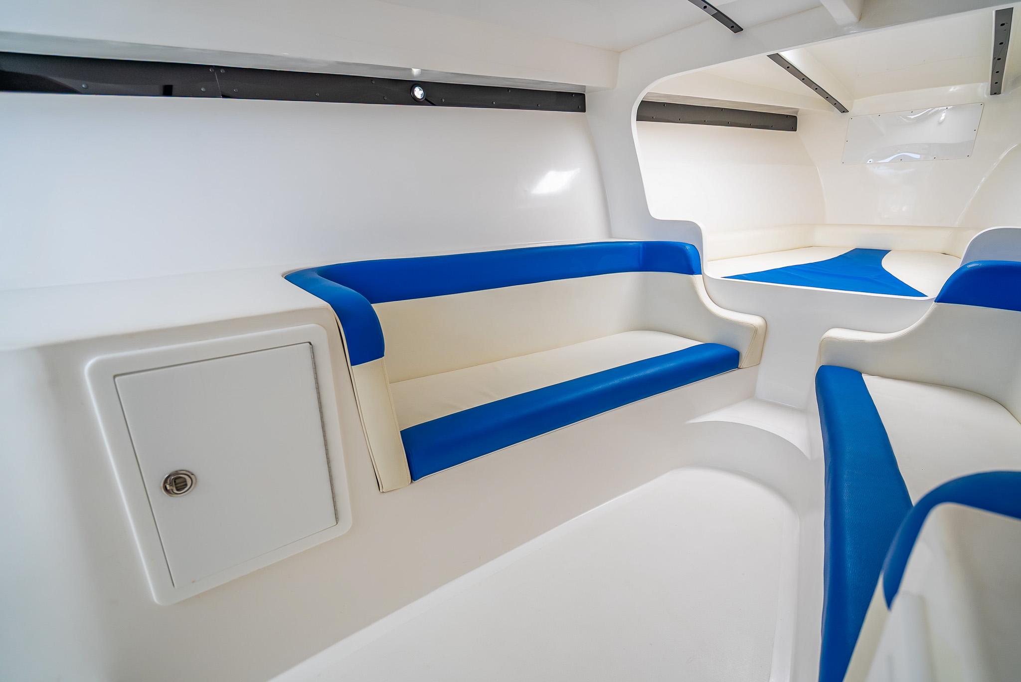 Interior of 2020 Nova 39 Sport boat with blue and white seating.