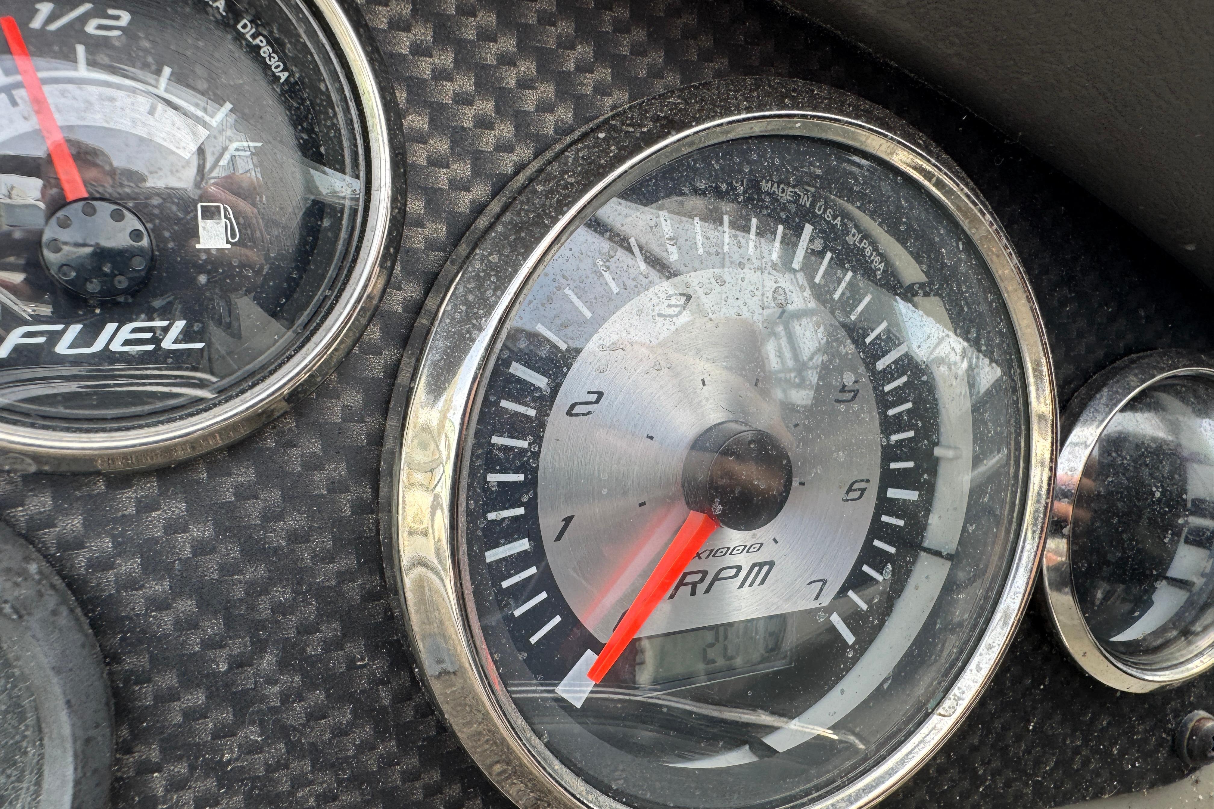 Close-up of 2018 Stingray 204 LR dashboard with RPM and fuel gauges.