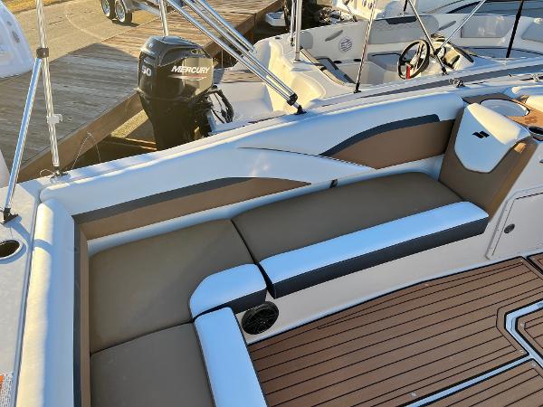 2024 Starcraft SVX 191 boat interior with cushioned seating and Mercury outboard motor.