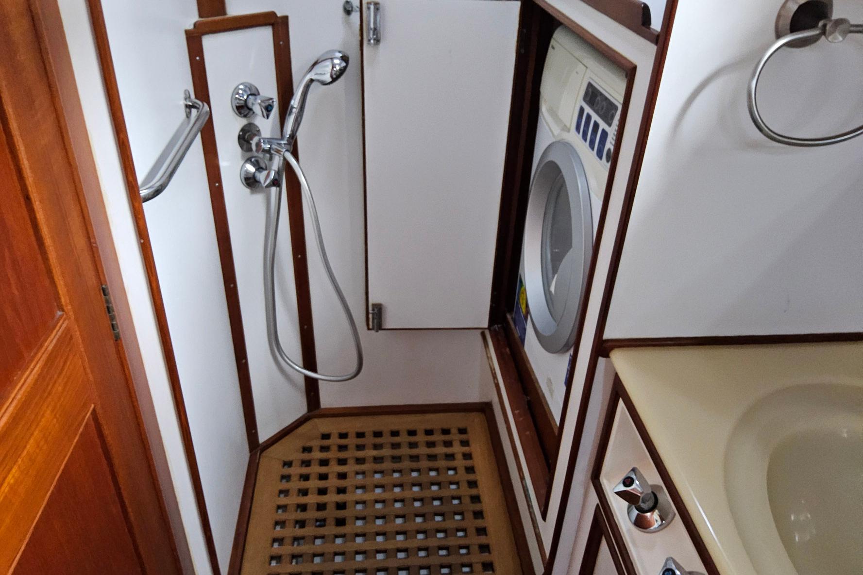 1997 Grand Banks 46 Europa yacht bathroom with shower and washing machine.