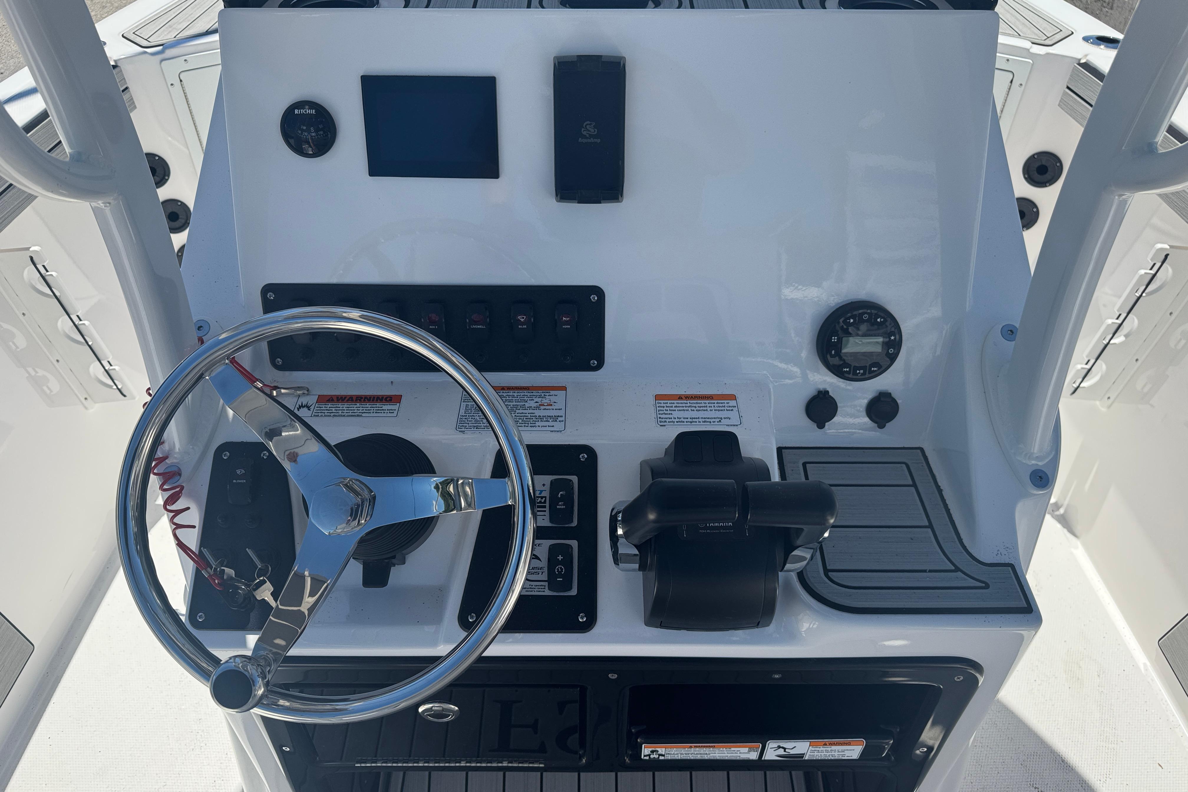 2026 Yamaha Boats 220 FSH Sport dashboard with steering wheel and controls.