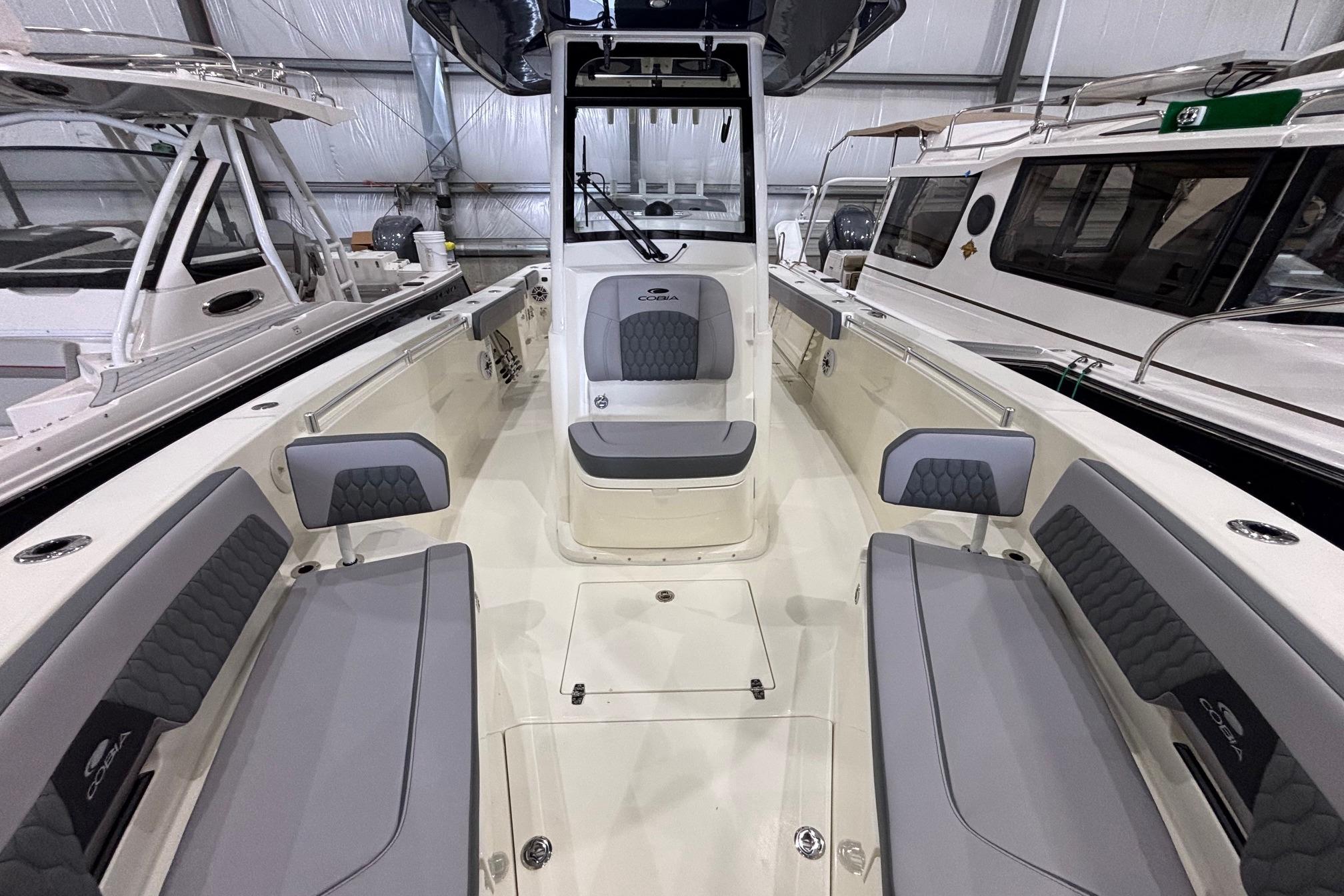 2026 Cobia 285 Open Center Console boat interior with seating and helm.
