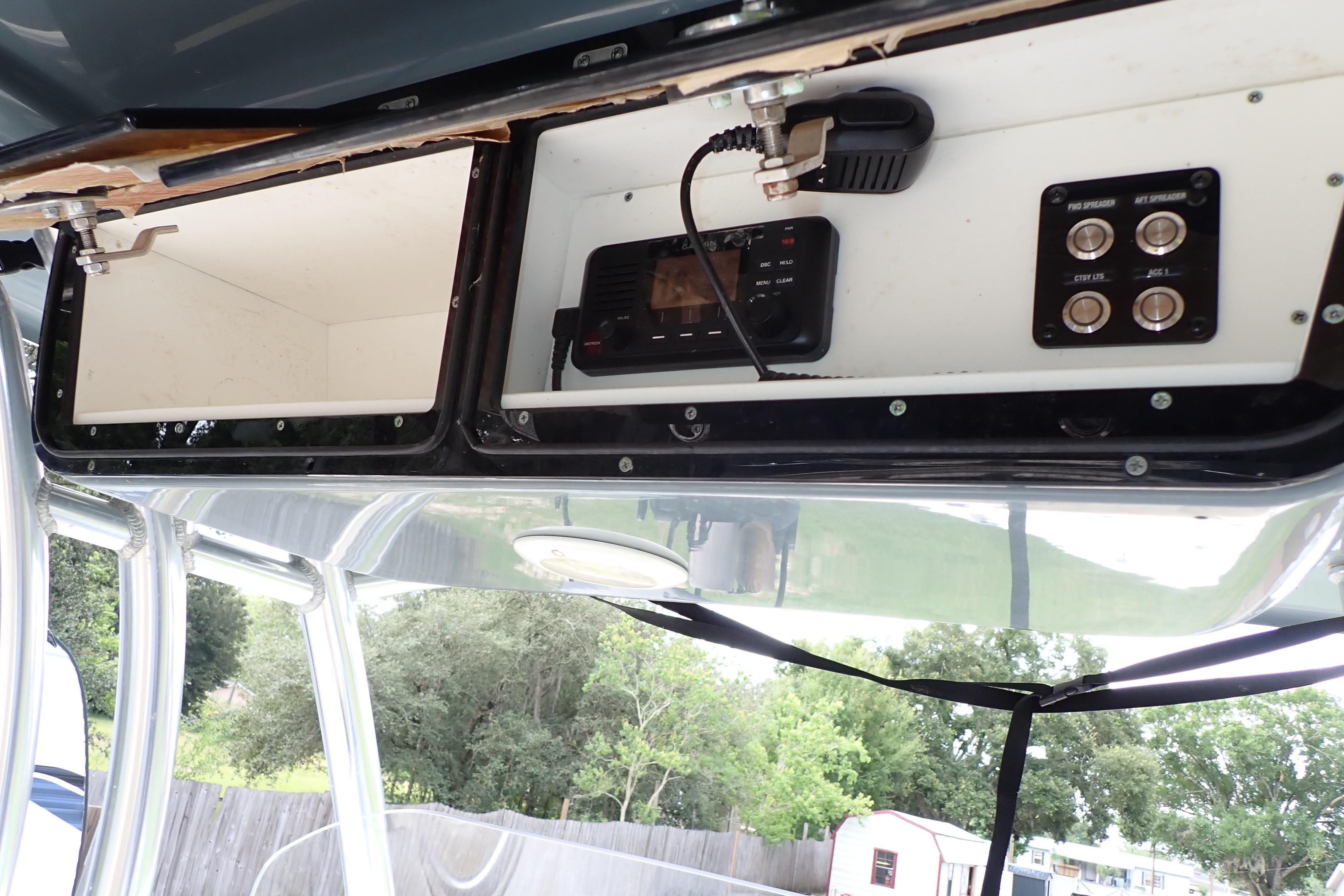 2019 Key West 263 FS boat console with radio and control panel.