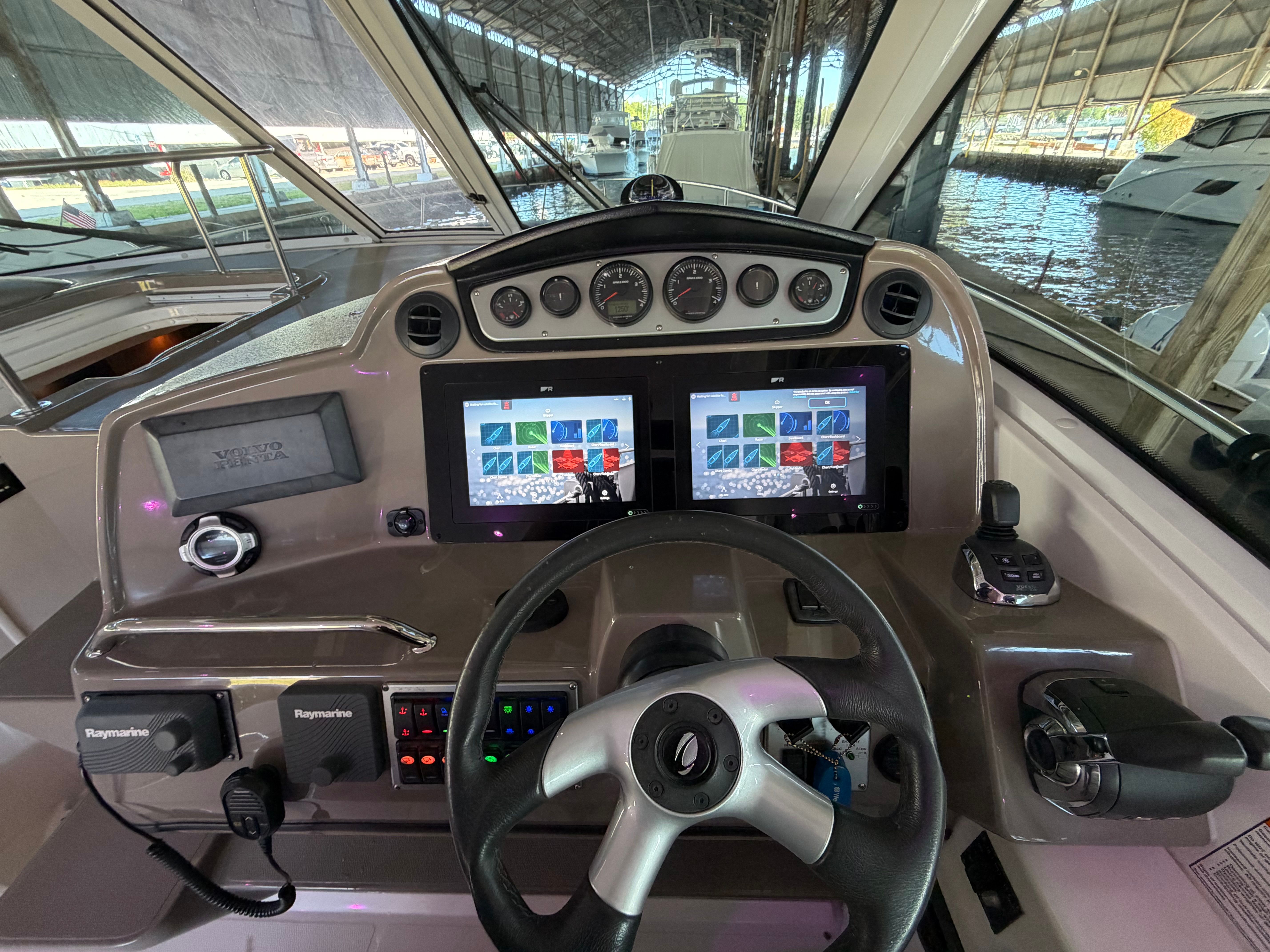 2012 Cruisers Yachts 430 Sports Coupe cockpit with modern navigation system.