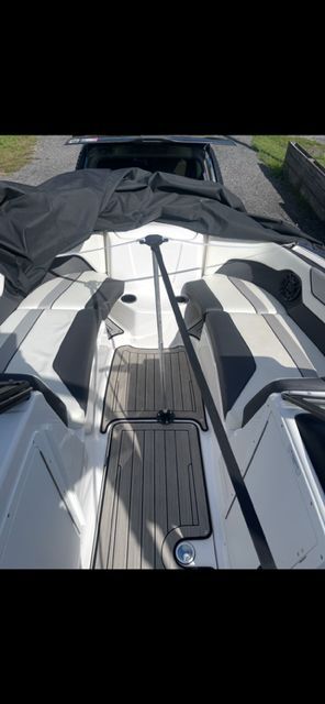 Interior view of a 2021 Yamaha Boats 212S with seating area.
