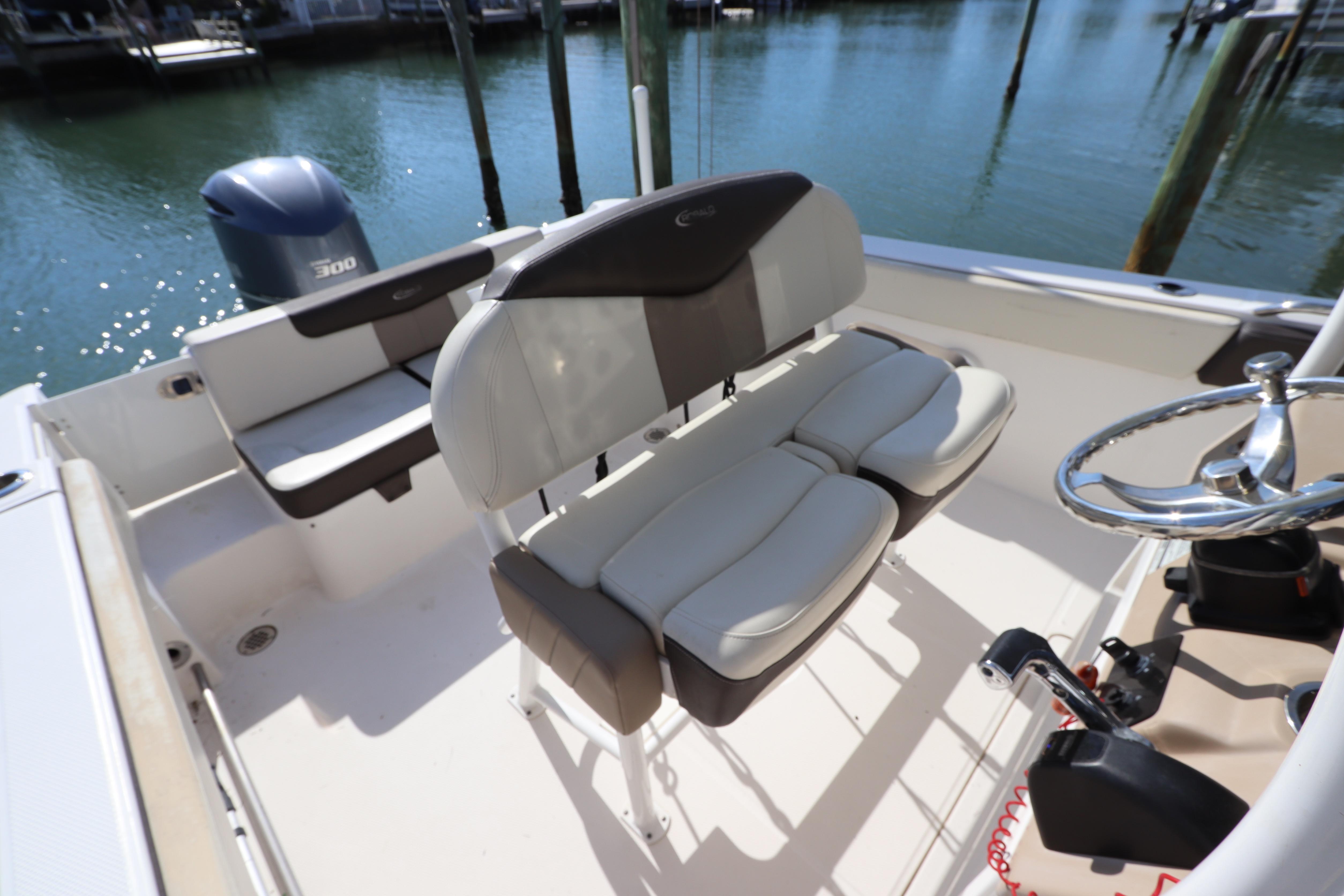 2019 Robalo R242 Center Console boat interior with seating and steering wheel.