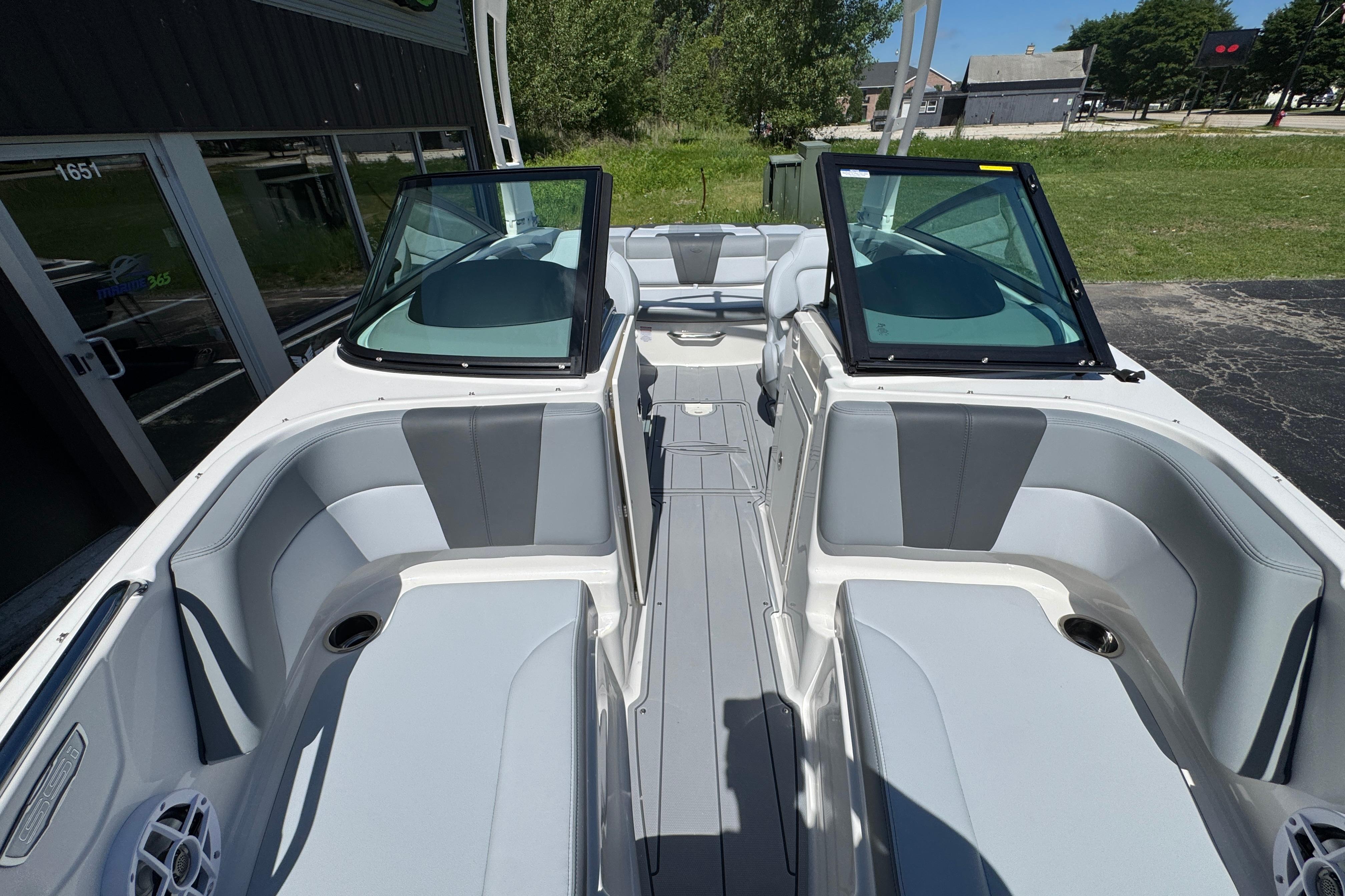 2026 Chaparral 21 SSi boat interior with gray seating and open windshield.