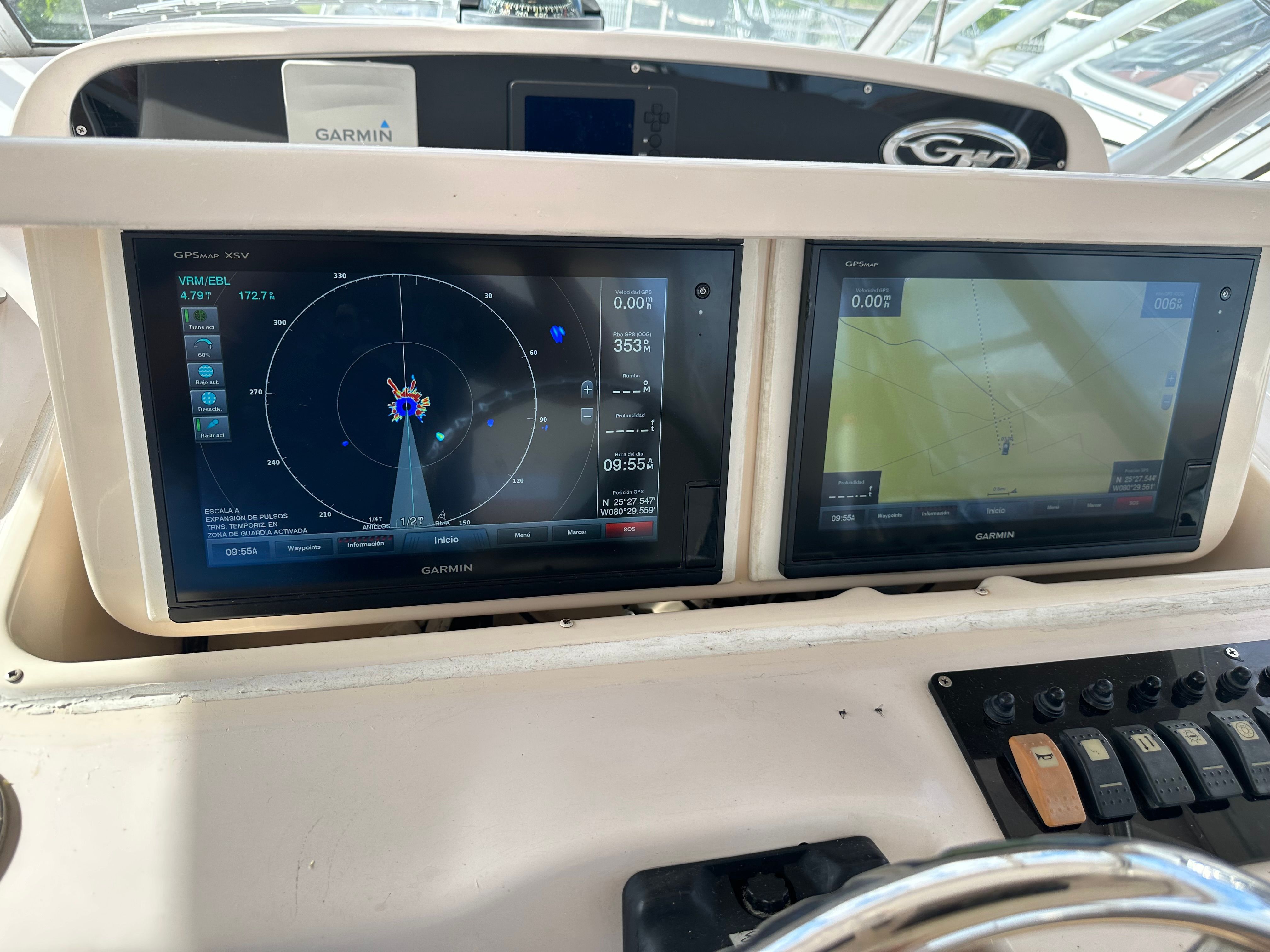 The image shows the dashboard of a Grady-White Express 330 with two Garmin screens.