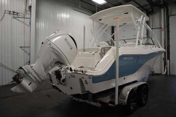 2025 Sea Fox 228 Traveler boat with Yamaha engine in a garage.