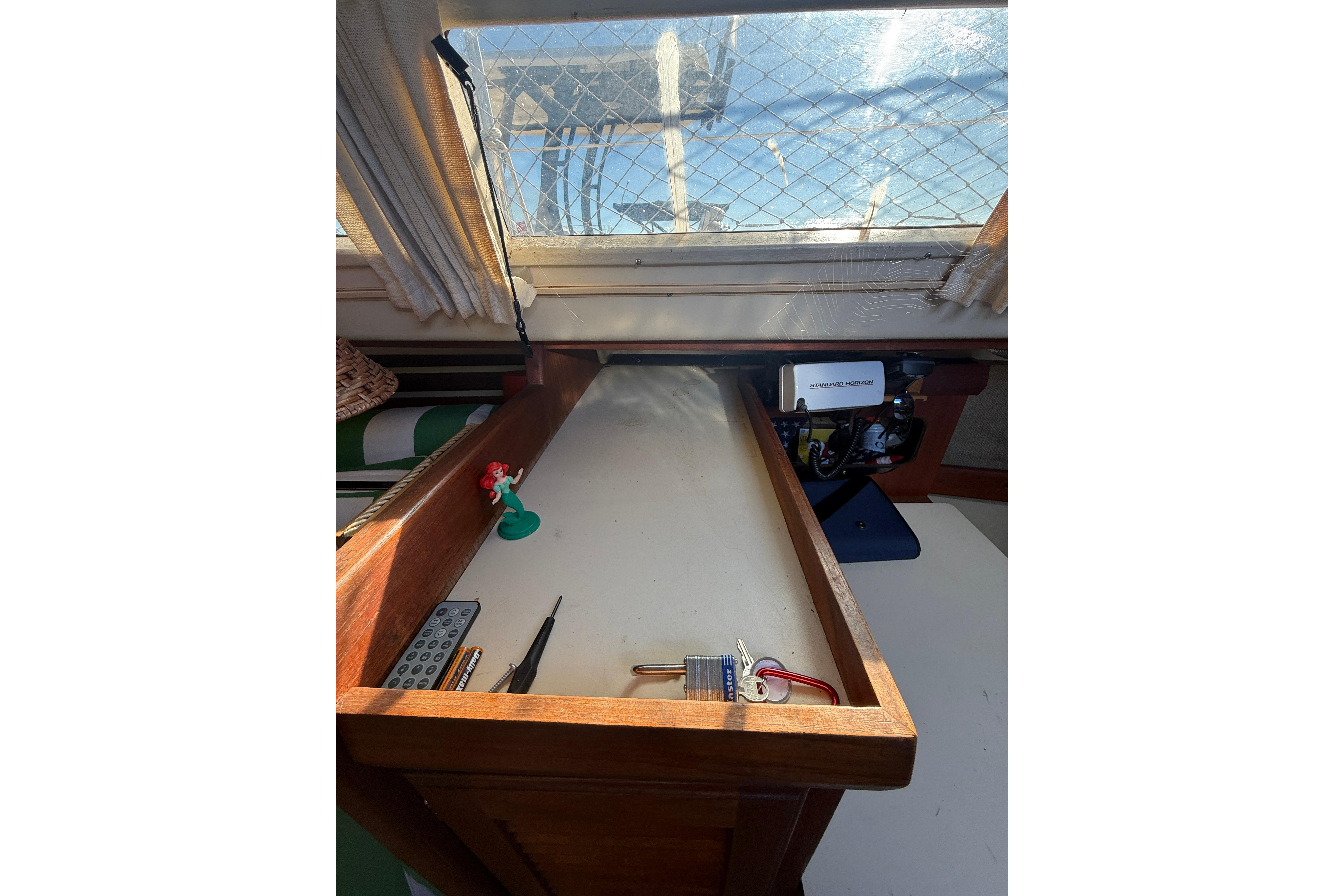 1983 O'Day 34 sailboat interior with navigation desk and window view.