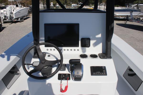 2025 East Cape 25 Open boat dashboard with steering wheel and electronic controls.
