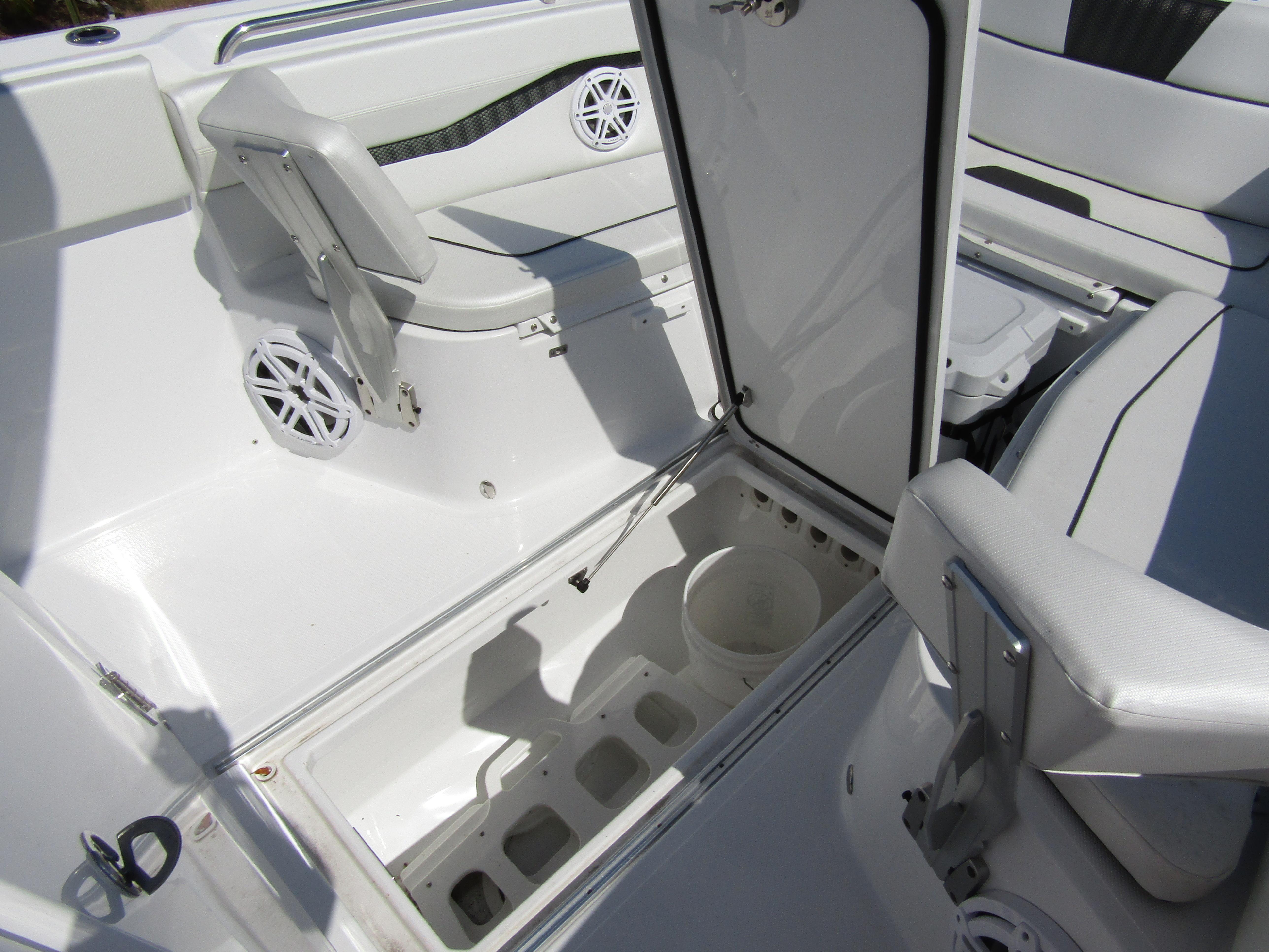 2024 Wellcraft 263 Fisherman boat interior with open storage compartment.