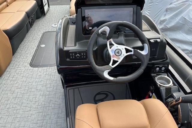 2026 Regency 250 DL boat interior with modern steering and dashboard controls.