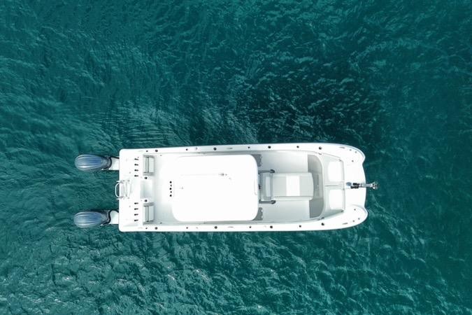 Aerial view of 2026 Twin Vee 280 GFX2 CC boat on clear blue water.