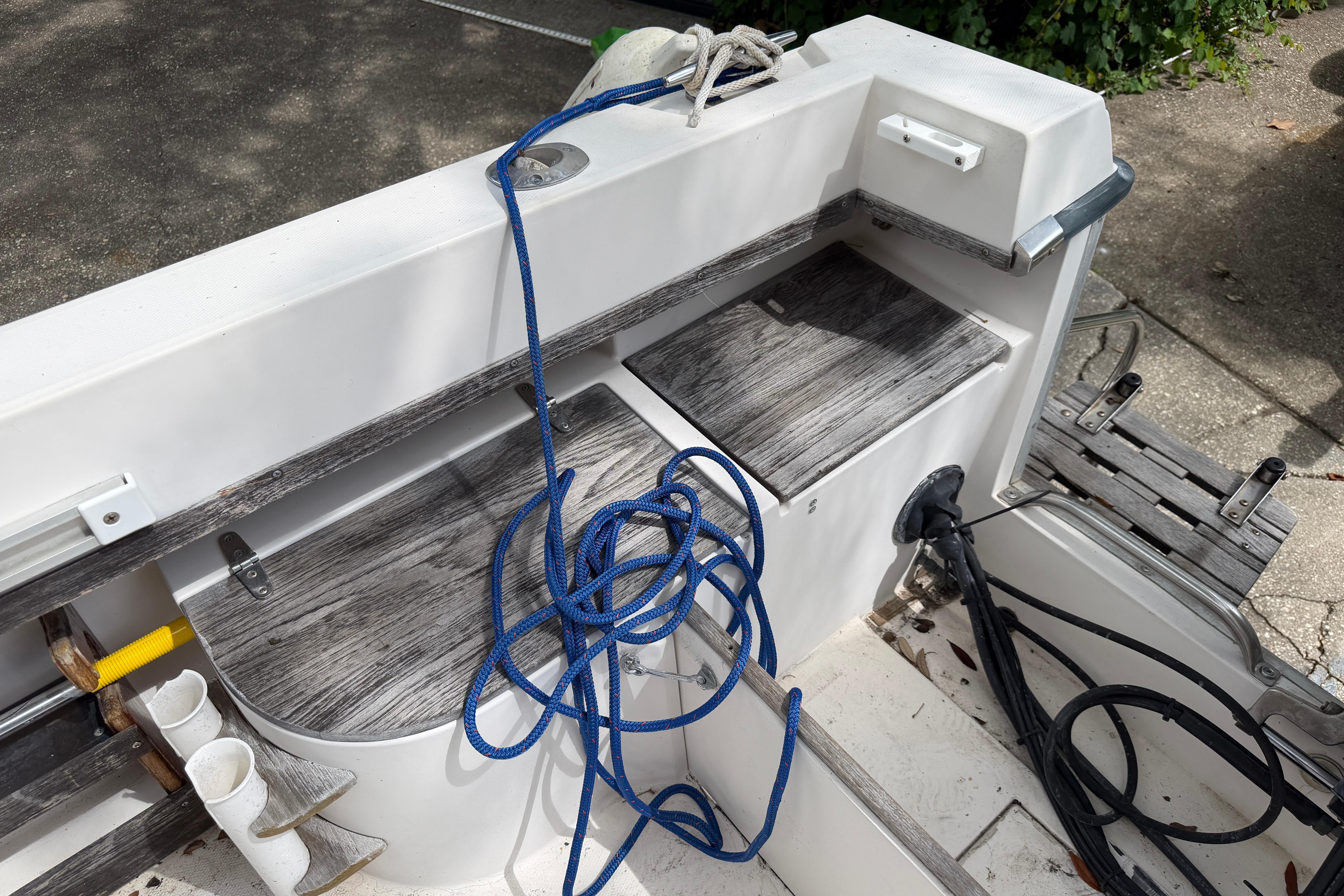 1987 Grady-White Seafarer 226 boat interior with blue rope and storage compartments.
