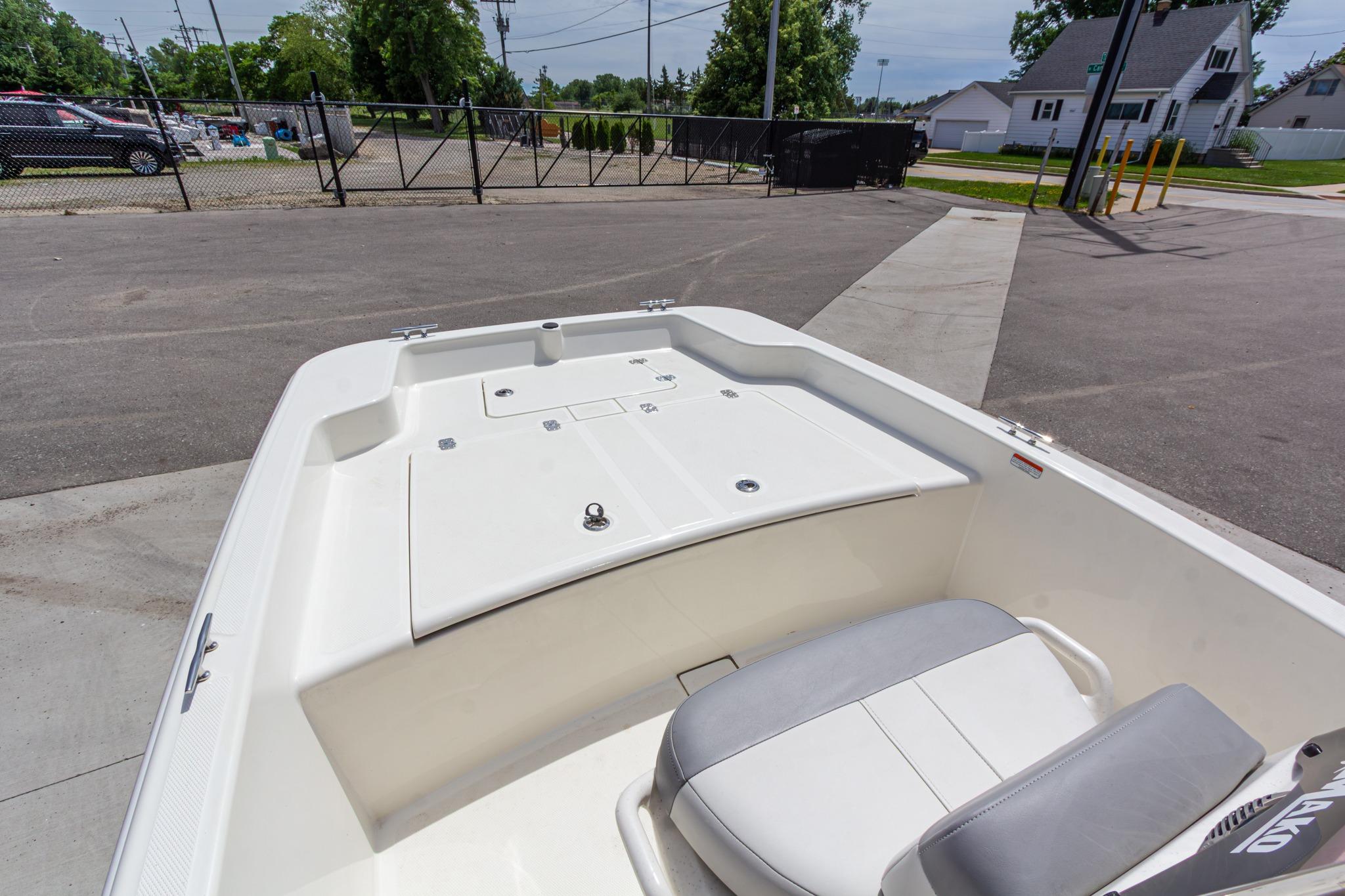 2020 Mako Pro Skiff 15 CC boat interior, featuring spacious seating and storage area.