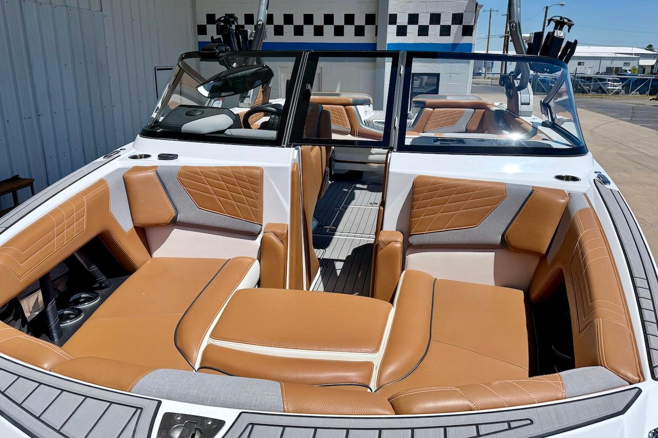 2021 Nautique Super Air Nautique G23 boat interior with tan and gray seating.