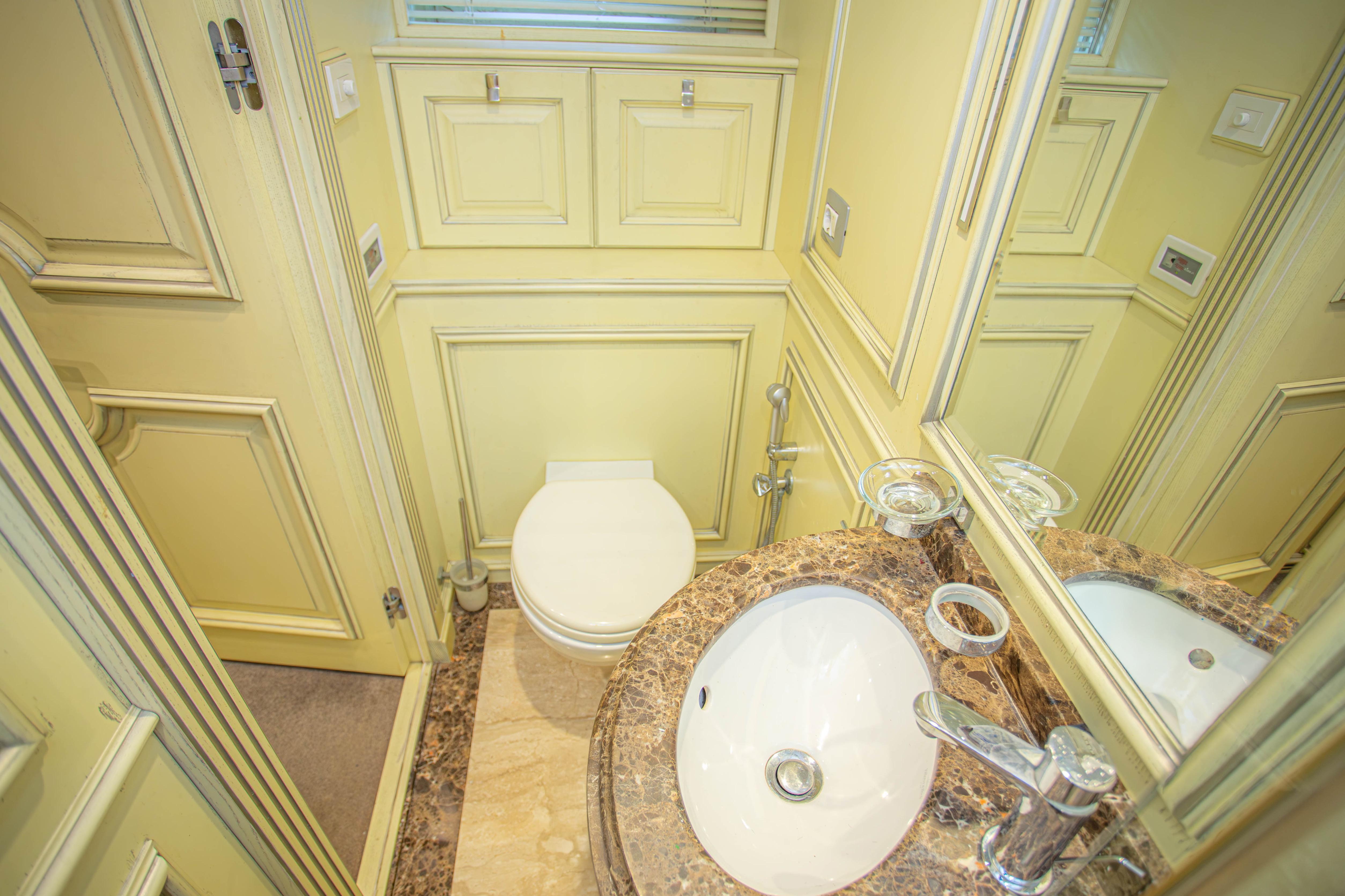 Luxurious bathroom in 2014 Fifth Ocean Yachts 24m Explorer Yacht with marble sink and elegant fixtures.
