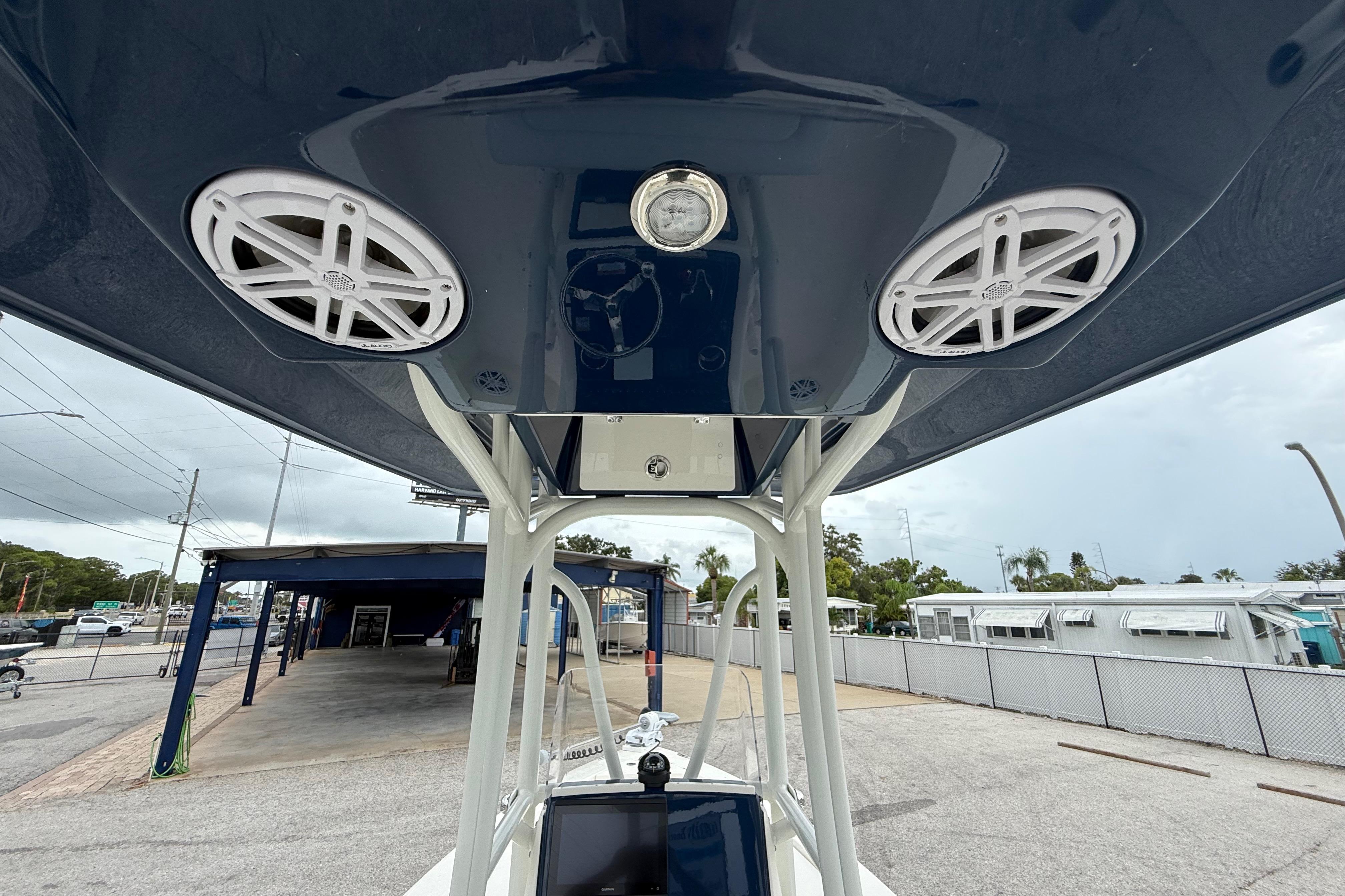 2026 Pathfinder 2300 HPS boat with speakers and light on the T-top.