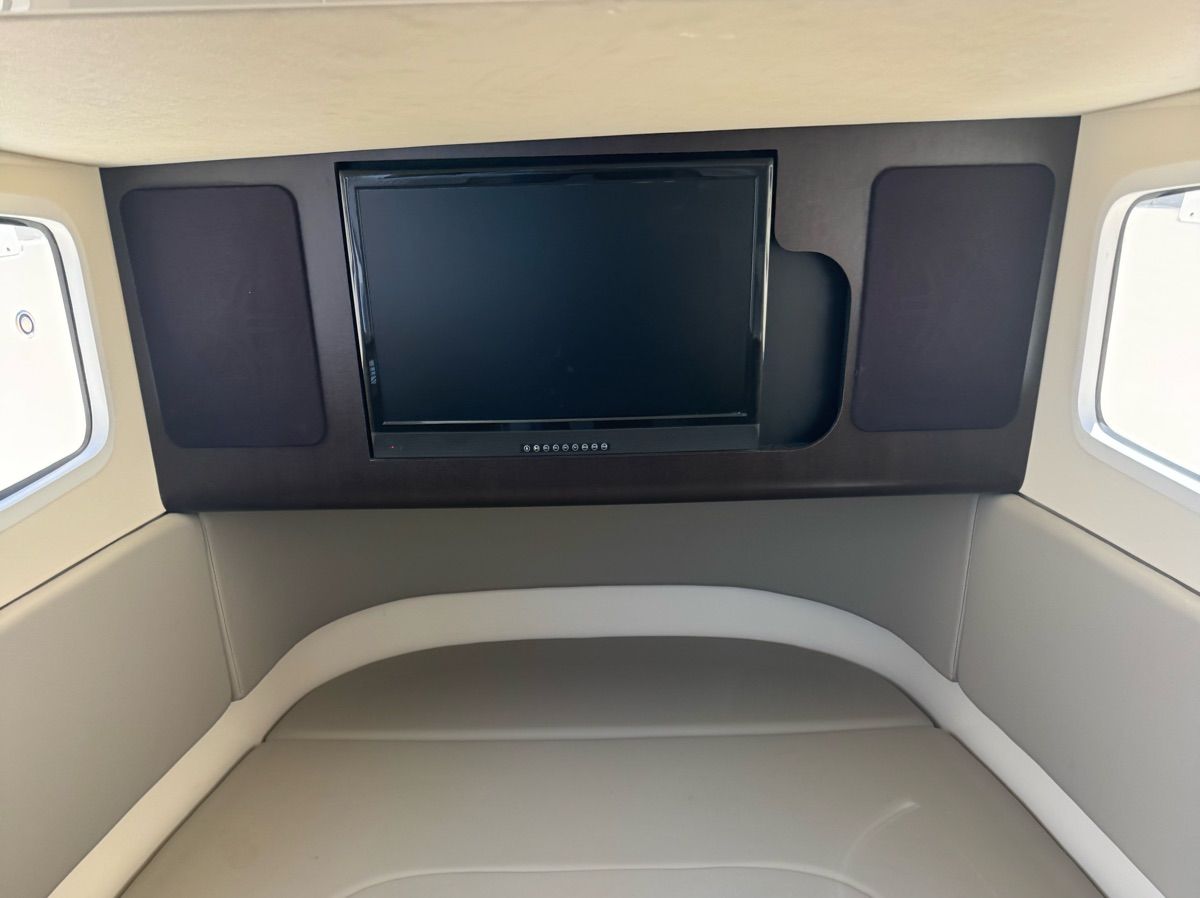 Interior of the Scout 355 LXF featuring a television.
