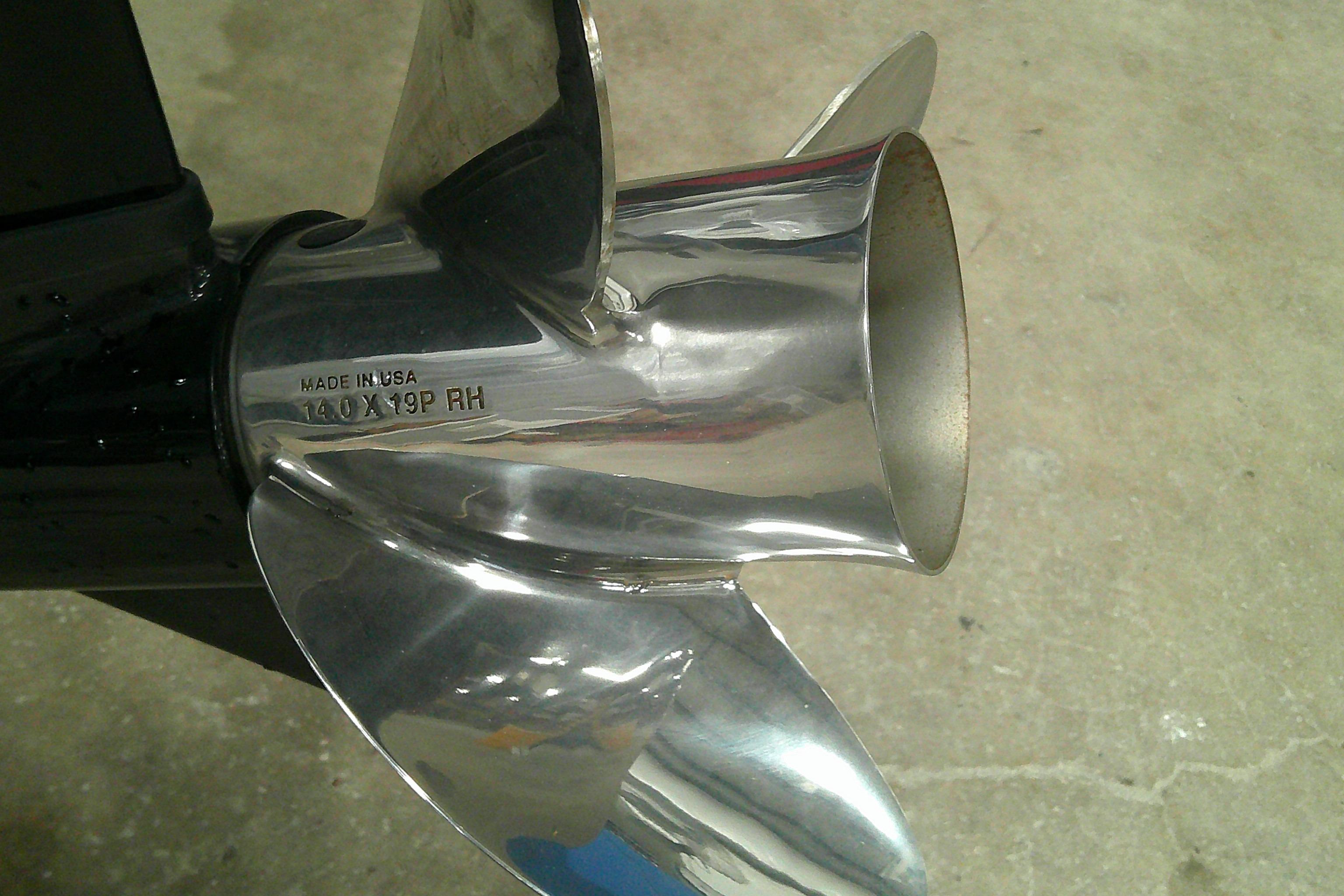 Shiny stainless steel boat propeller on a Tahoe 2150 CC, 2026 model.