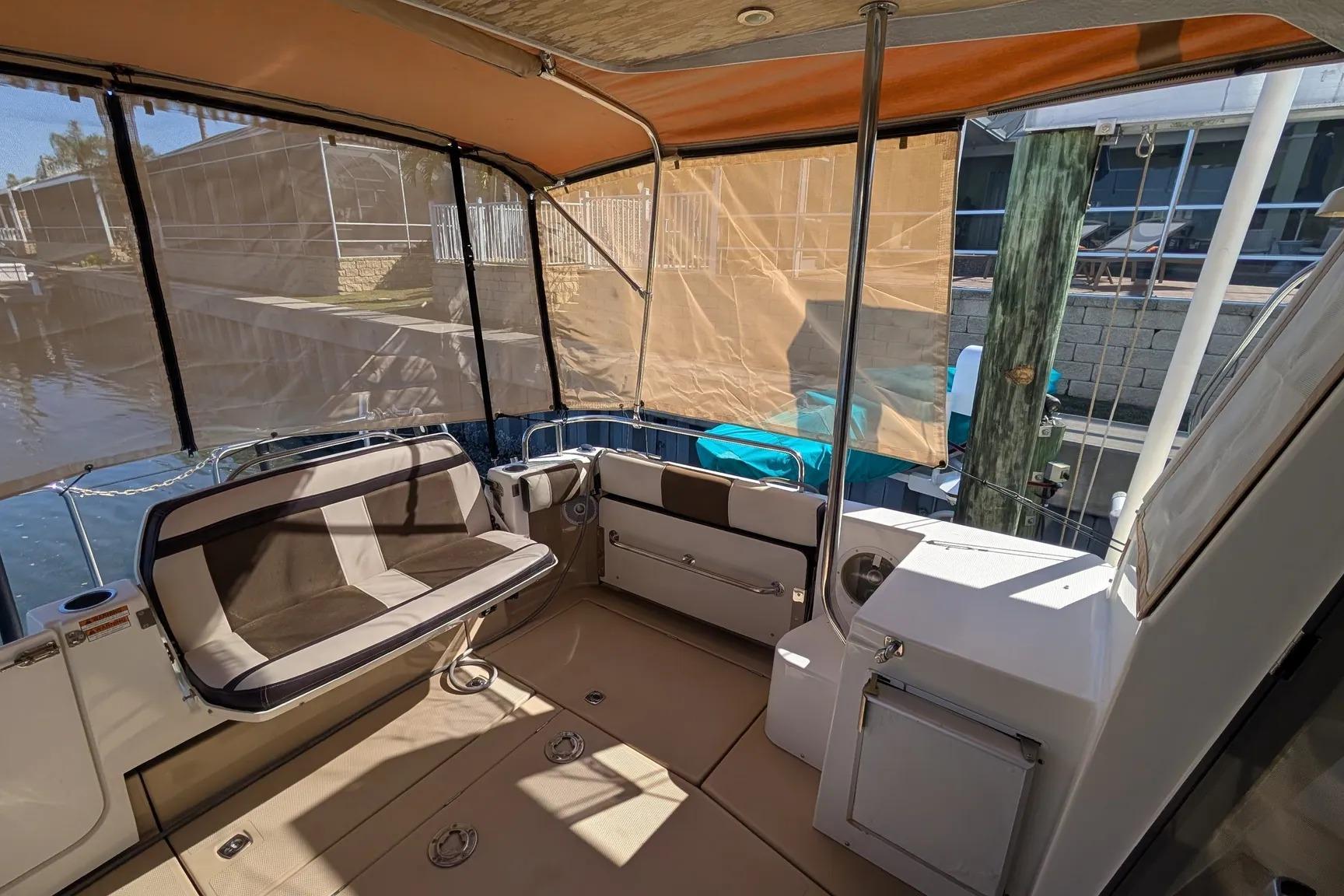 2015 Ranger Tugs R-29 S boat interior with seating and canopy.